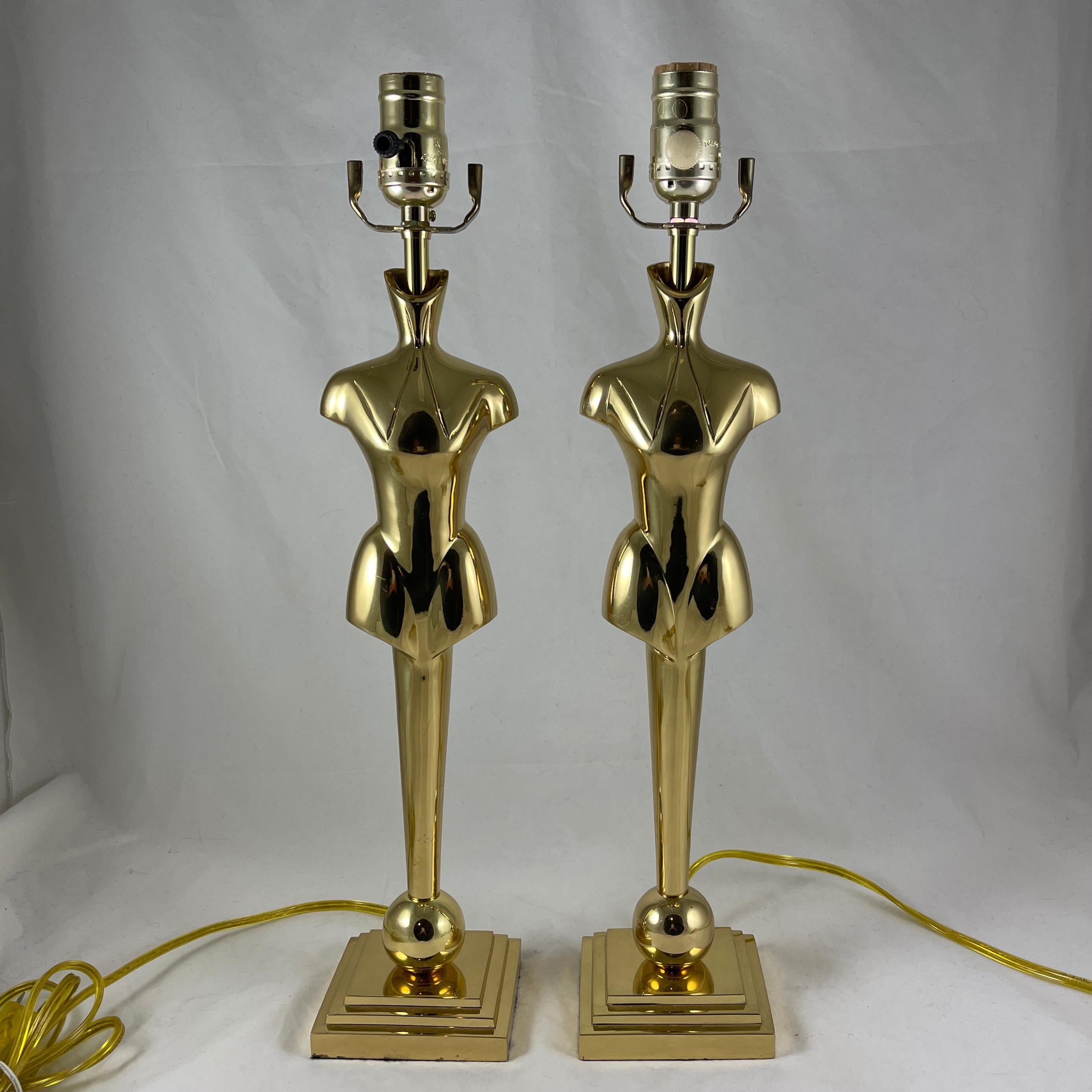 For the pair, fabulous and unusual, tall mid-century brass torso statement lamps, France, circa 1960s.

From a Gentlemans’ Clothier Boutique, this pair would look at home in a mens dressing room, den or game room.
The figure resembles a mens