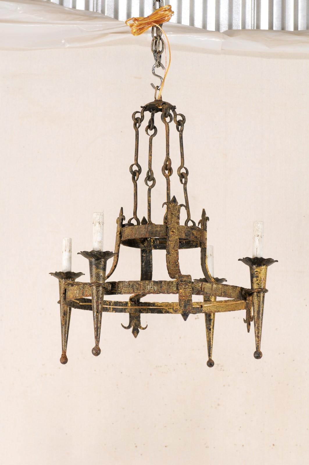 French Tiered-Ring Gilt Iron Chandelier, Fleur di Lys Motif In Good Condition For Sale In Atlanta, GA