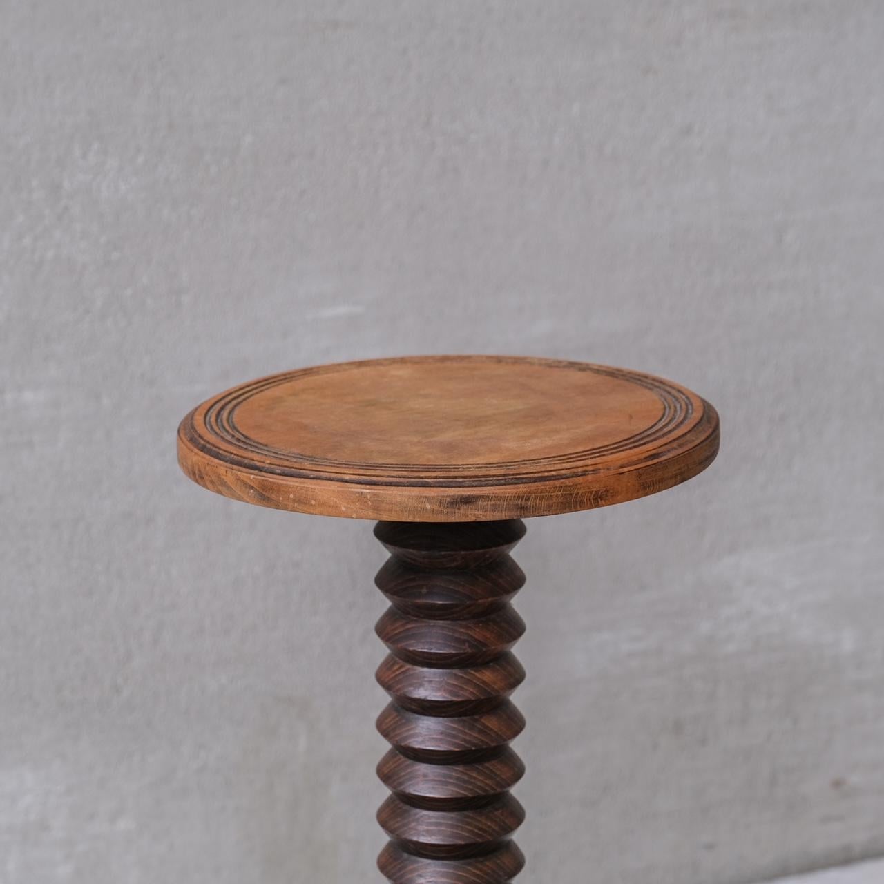 A turned oak pedestal or plant stand in the manner of Dudouyt.

France, c1950s.

Ideal for sculpture, lamps or plants.

Good vintage condition, some scuffs and wear commensurate with age.

Internal Ref: 12/9/23/007.

Location: Belgium