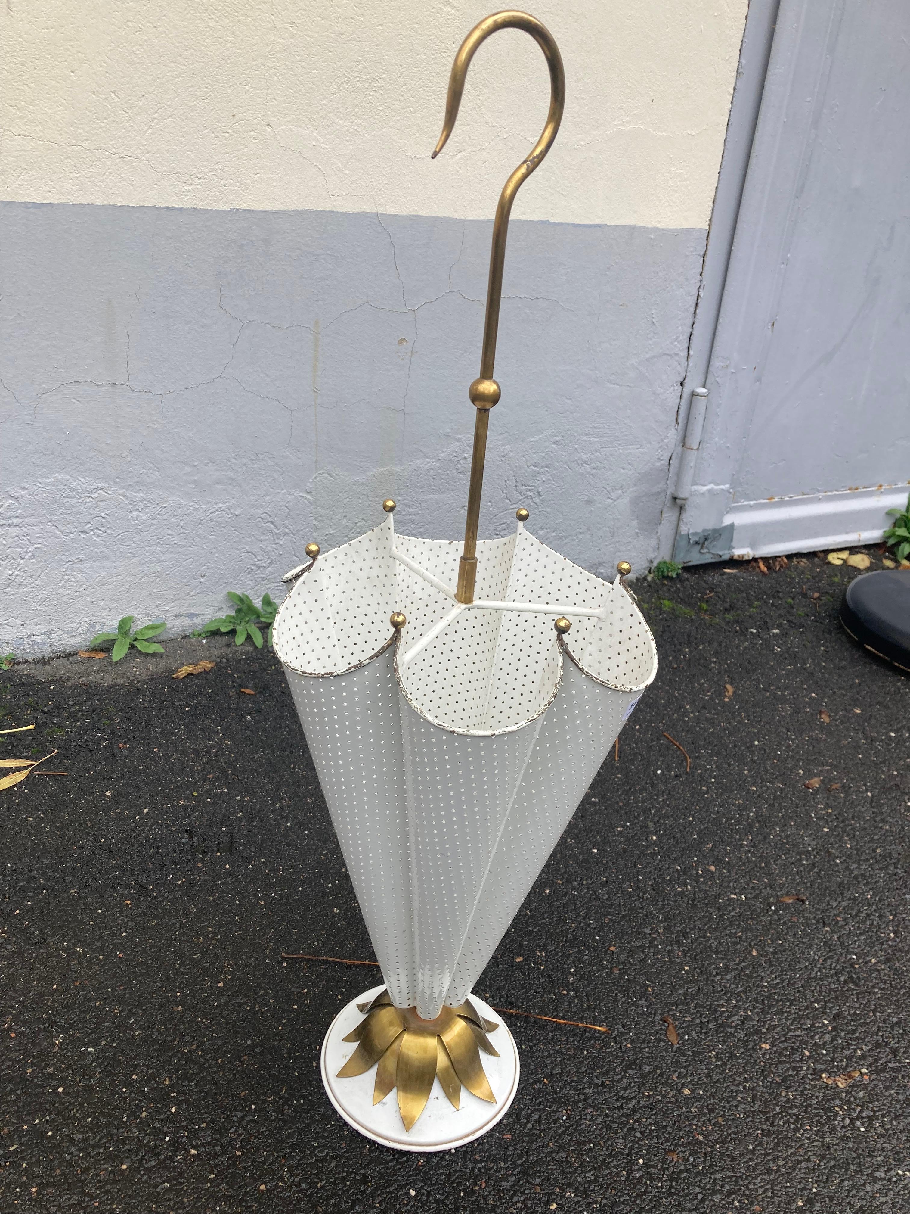 Amazing French Mid Century umbrella stand attributed to Matthieu Matégot. 1950s.
Made of Ivory colour to off-white enameled and performed metal combined with brass elements. Designed to an umbrella shape with handle. It is not only a decorative