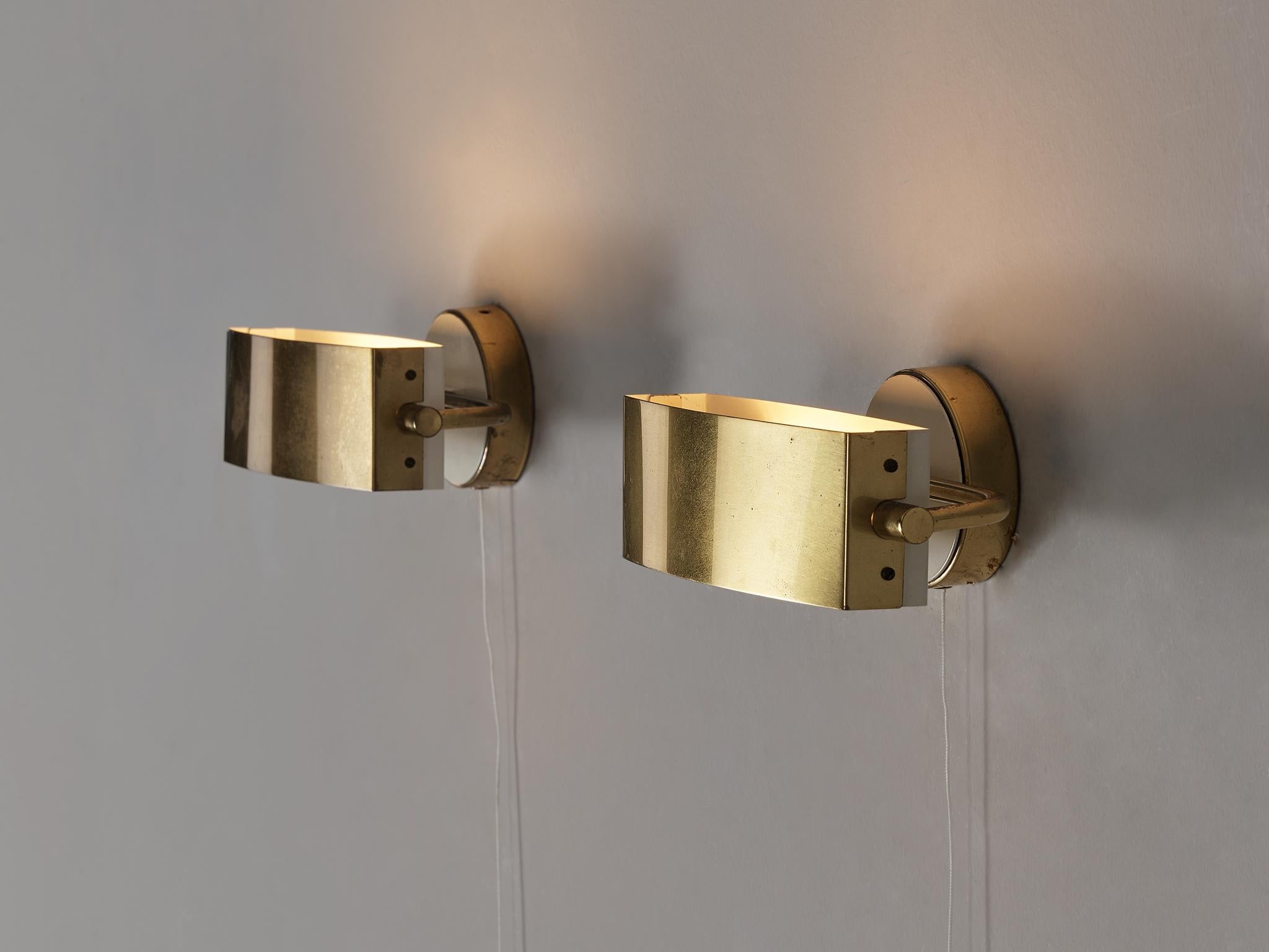 Wall lights, brass, coated aluminum, coated steel, France, 1950s

These exquisite French wall lamps showcase a delicate aesthetic executed within a simple layout. The interplay of brass and white elements gives these sconces a luxurious appearance.
