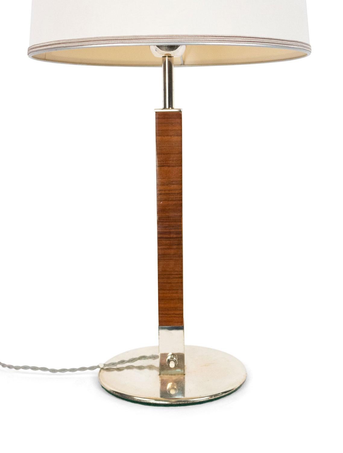 French 1940s light walnut square column table lamp mounted on a round chrome base with conical white shade.

Ships with shade.
