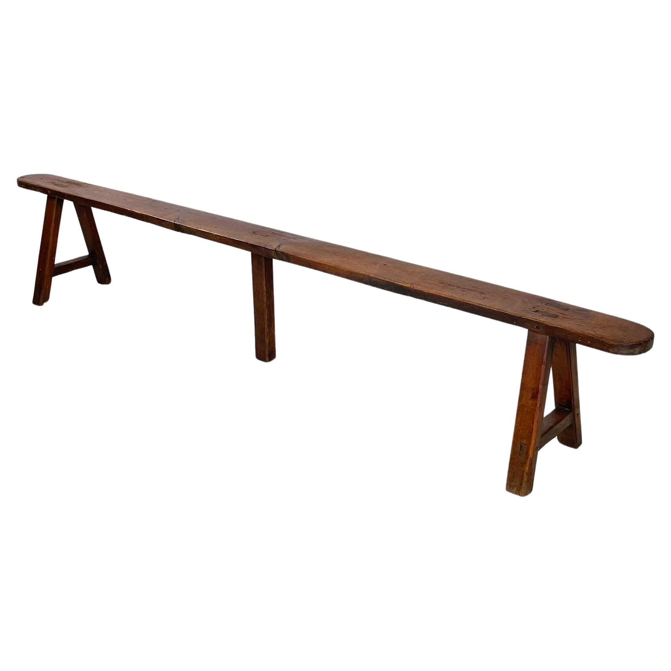 French mid-century Wooden bench with narrow and long seat, 1930s