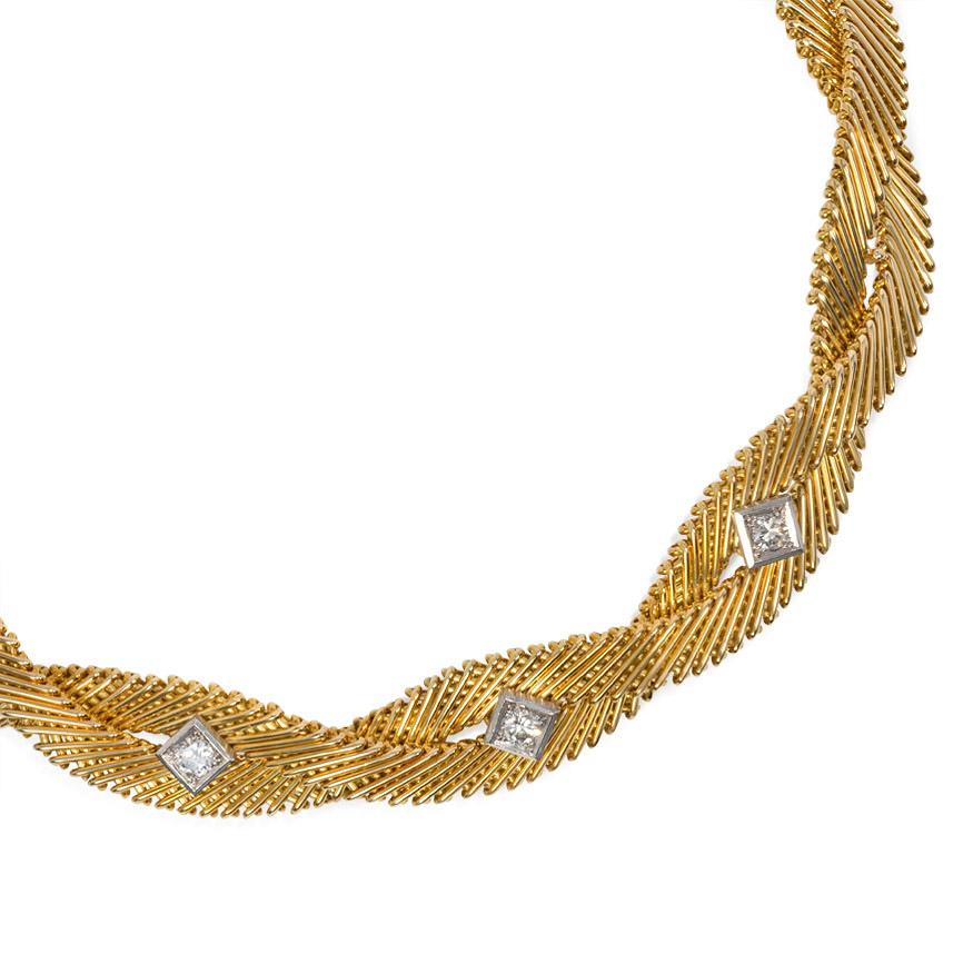 A mid-twentieth century gold and diamond necklace of twisted yellow gold wire design, accented in the center with three brilliant-cut diamonds set in white gold square frames, in 18k.  France.  Atw 0.75 ct.  74 dwt, 115.1 grams

* Includes letter of