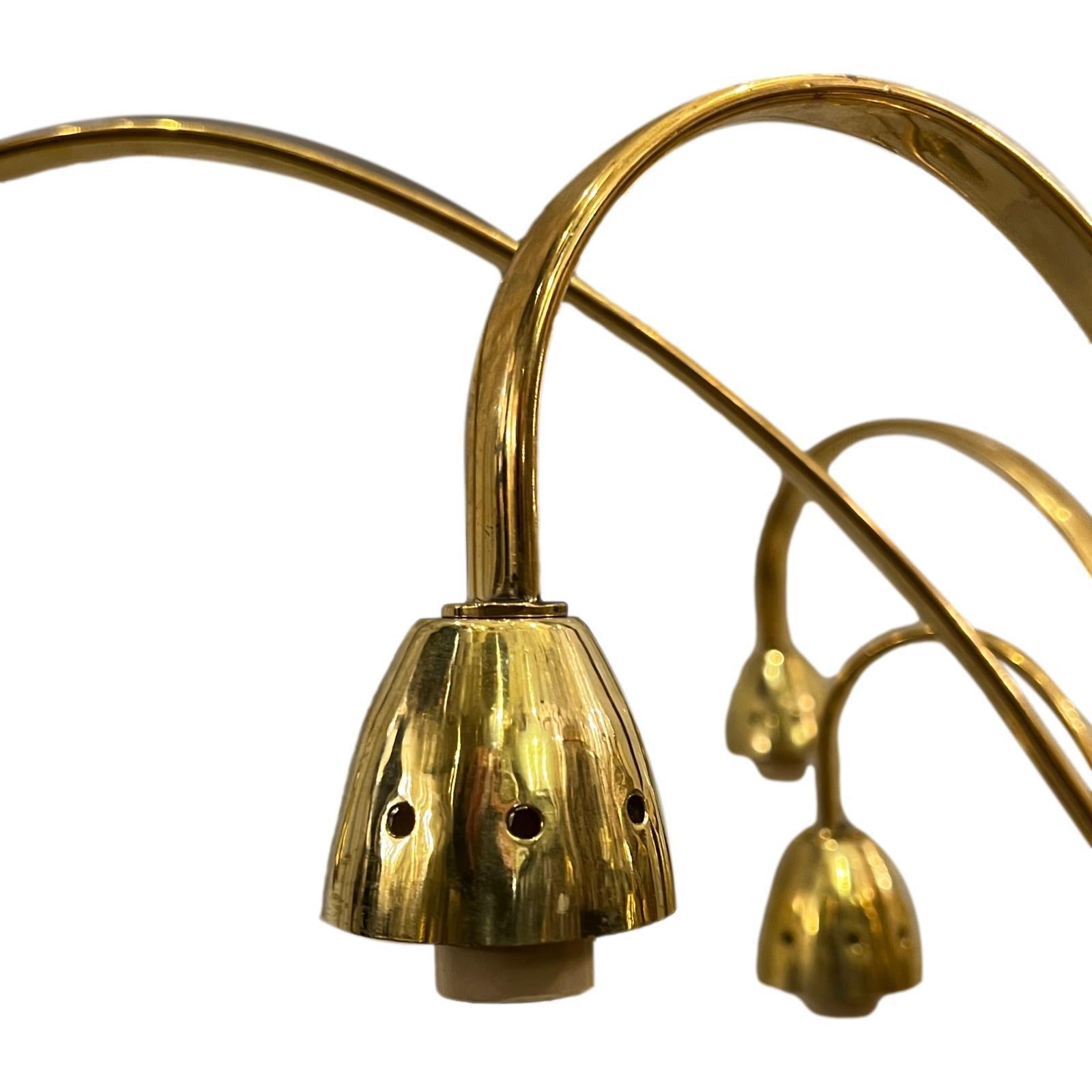 A circa 1960's French polished bronze chandelier with 12 lights.

Measurements:
Current drop: 28
