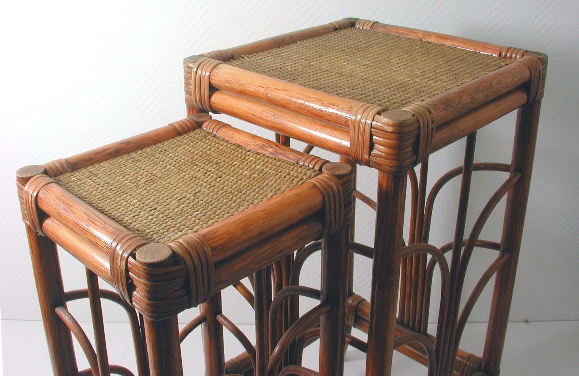 These elegant bamboo stacking nesting tables were designed and manufactured in France in the 1950s. They can be used as end tables or as plant stands.

Measures: Small table: H 22