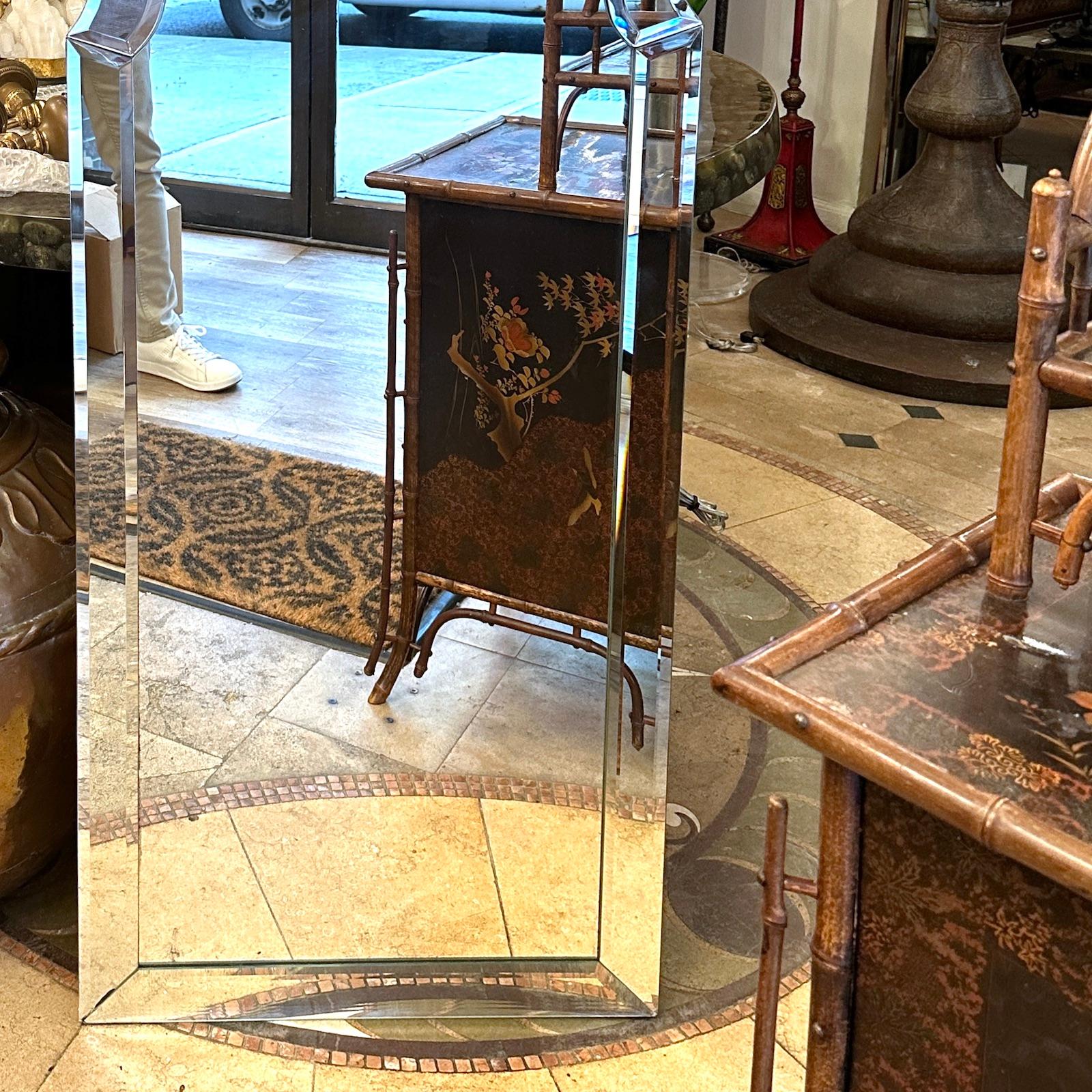 A circa 1950's French mirror with beveled frame.

Measurements:
Height: 52
