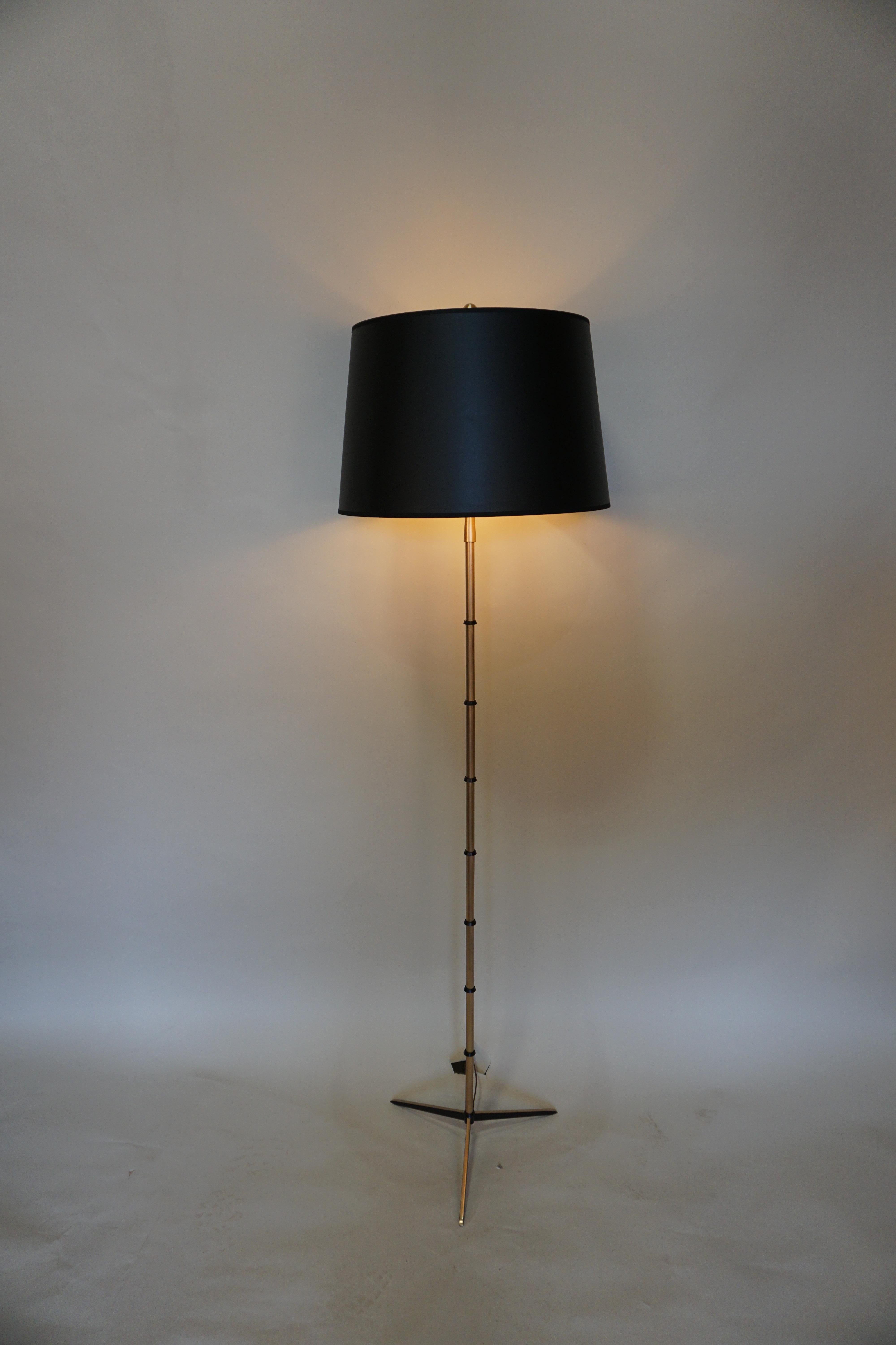 French midcentury bronze with black lacquer accent floor lamp.
Double light, new black gold interior shade.