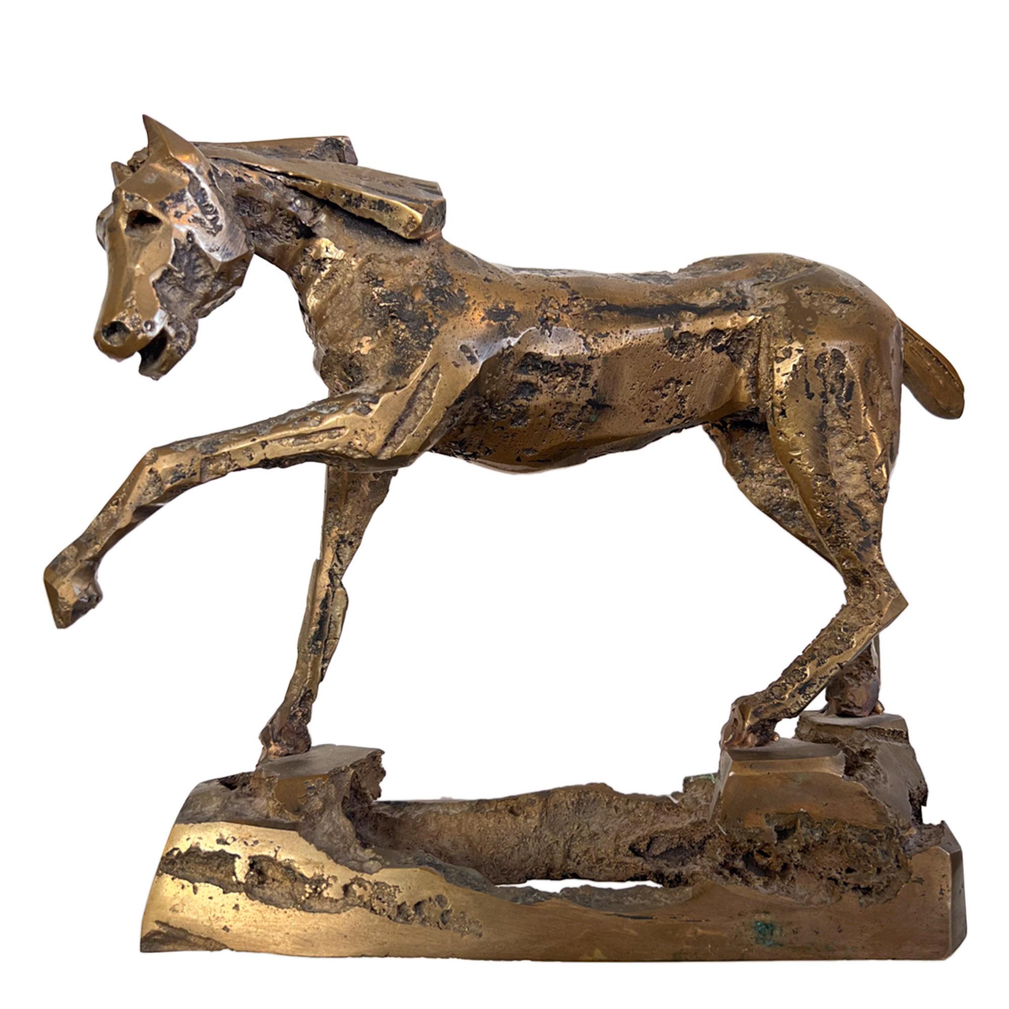 This beautiful bronze sculpture was made in France in the middle of the 20th century. 

The horse is standing with it's left front leg raised in a natural pose. Life-like and elegant, it has a slight brutalist look, while retaining a true