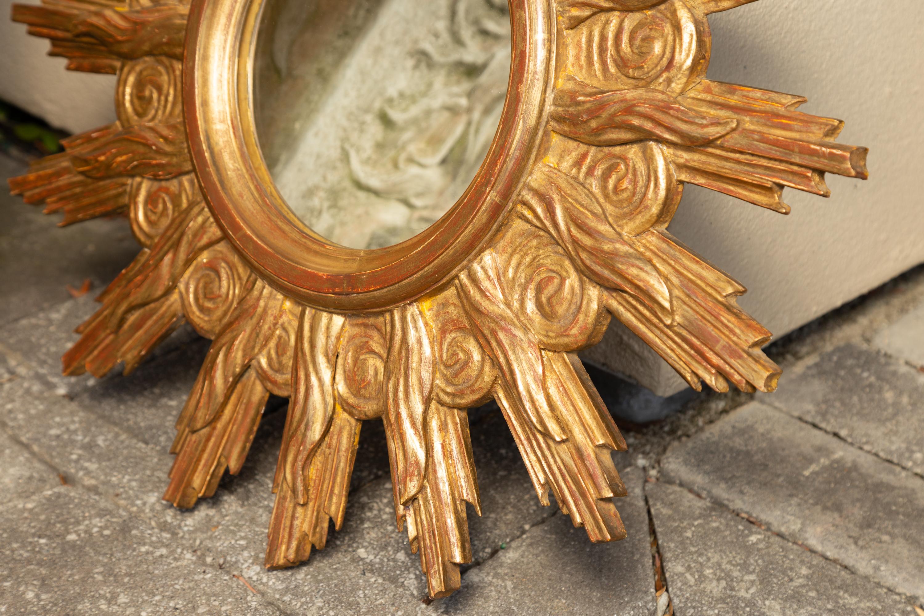 French Midcentury Carved Giltwood Sunburst Mirror with Cloudy Frame For Sale 4