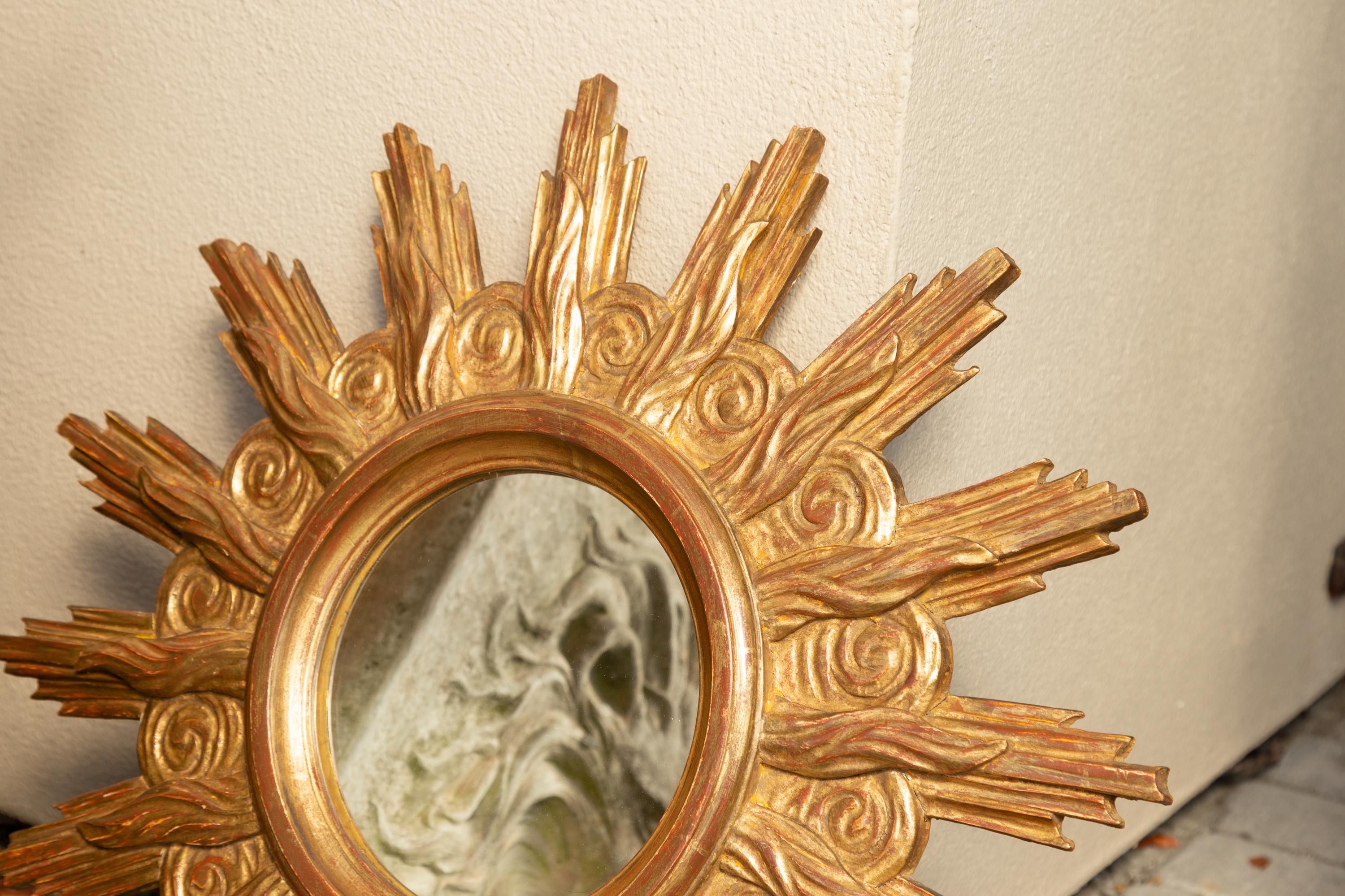 French Midcentury Carved Giltwood Sunburst Mirror with Cloudy Frame For Sale 6