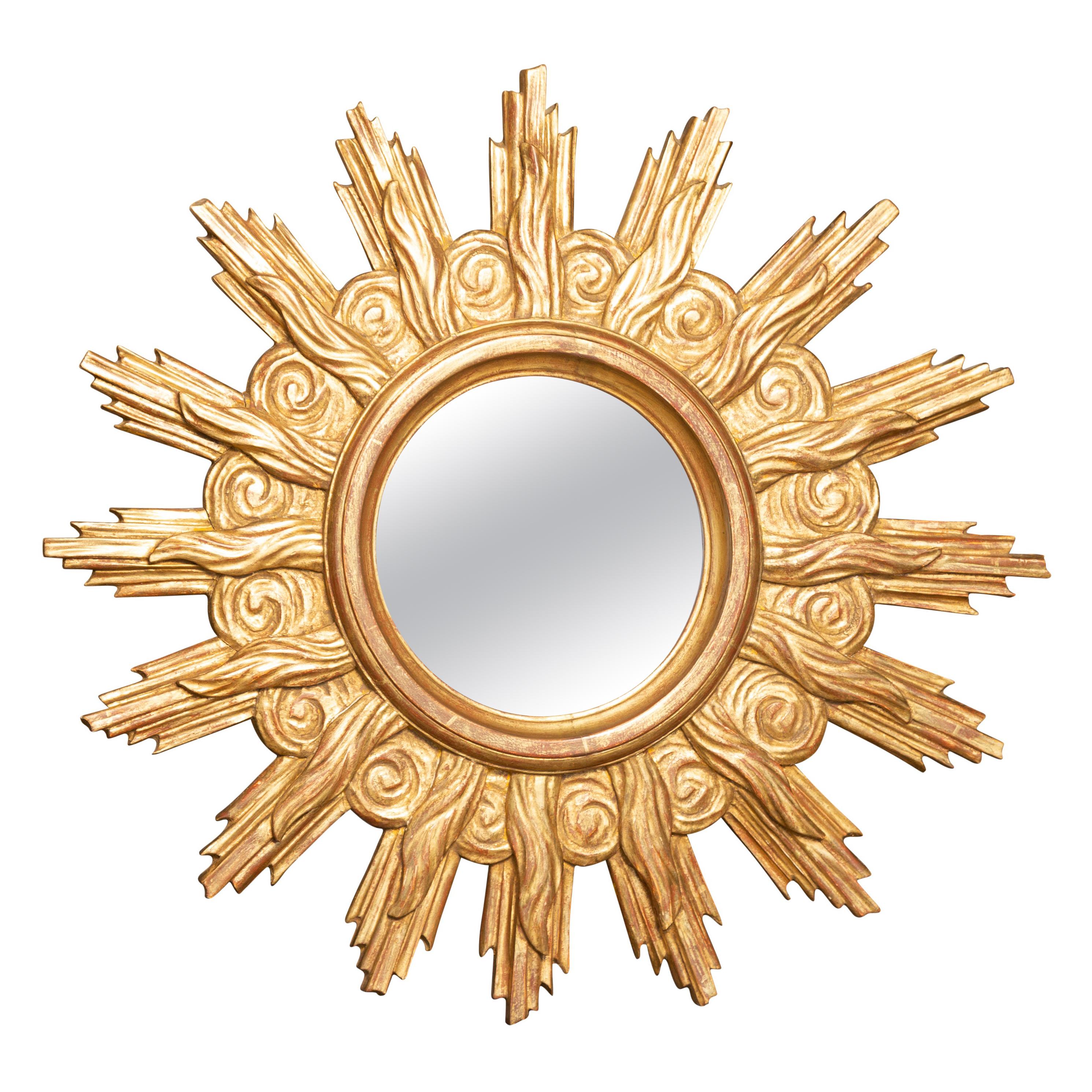 French Midcentury Carved Giltwood Sunburst Mirror with Cloudy Frame For Sale