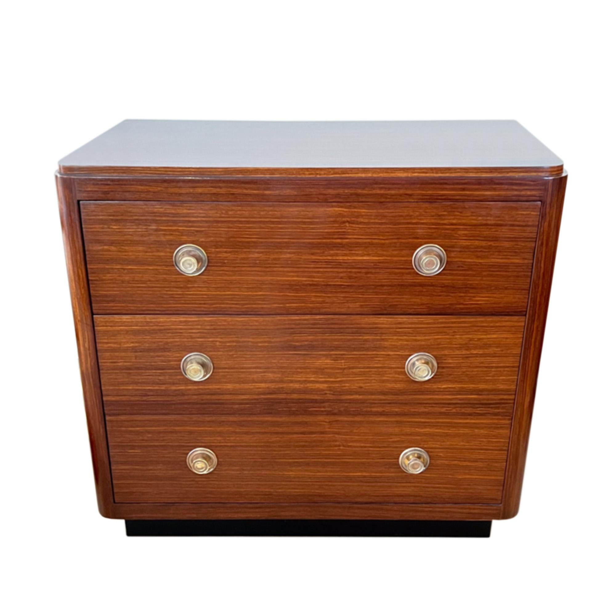 This stylish and neat midcentury chest of drawers was made in France in the 1960s.

Please take a look at all our pictures to see the beautiful colour and grain of the teak wood and the attractive circular handles. 

The perfect size for a smaller
