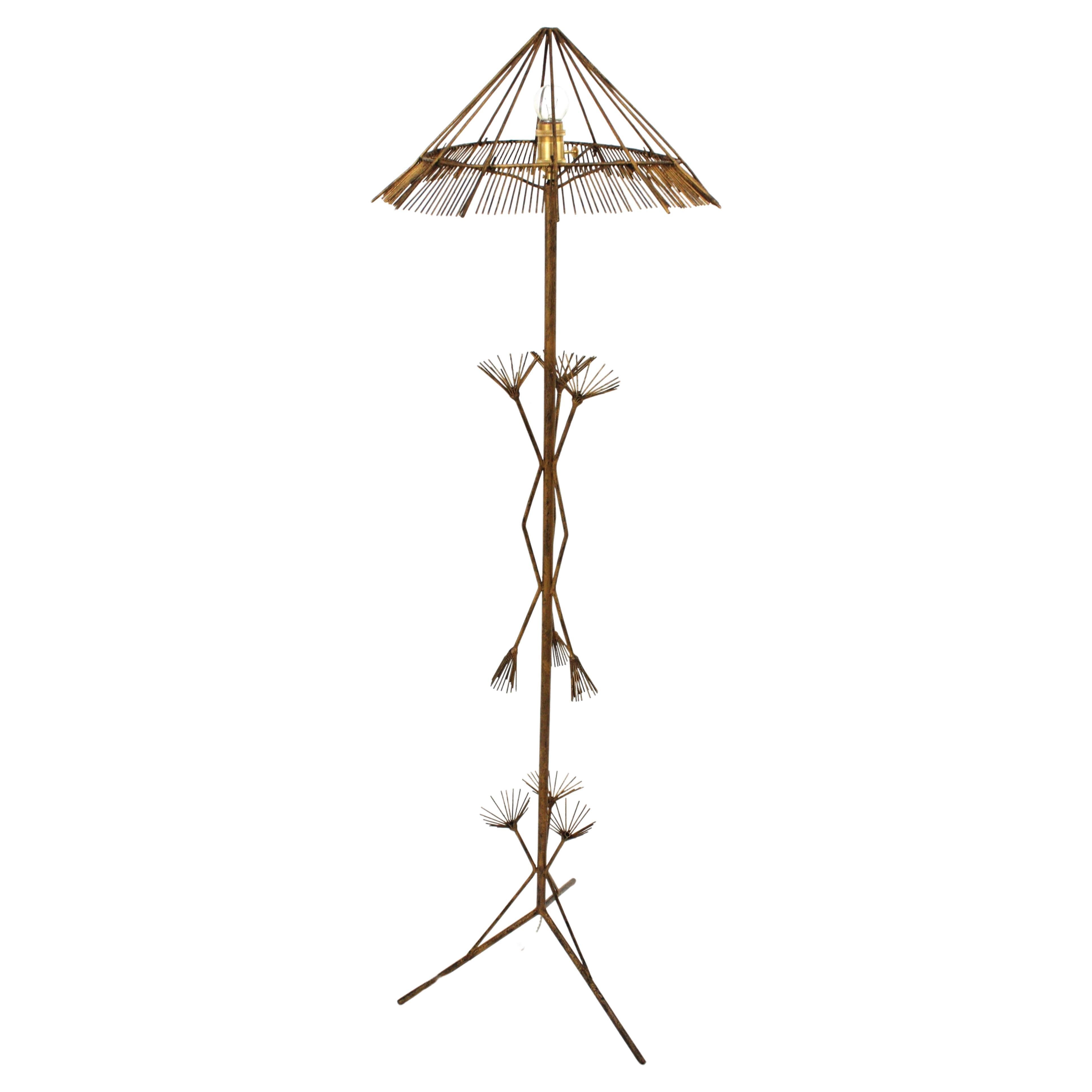 One of a Kind Gilt Iron Chinoiserie inspired Tripod Floor Lamp in Gilt Iron,  France, 1950s
Eye-catching tripod floor lamp made in France at the Mid-century Modern period with Chinoiserie accents.
Beautiful design with oriental inspiration and