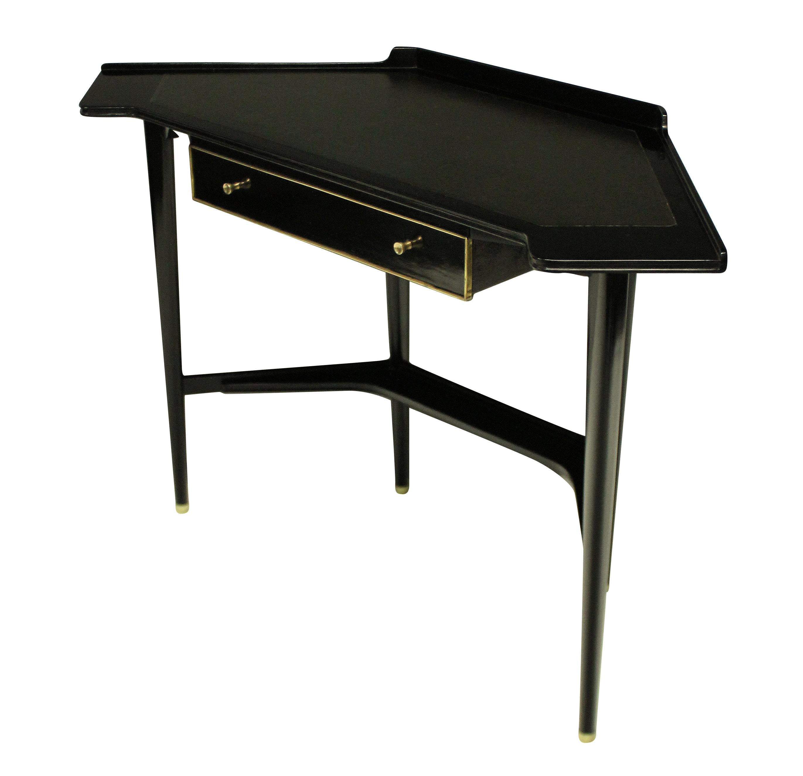 A French midcentury corner desk, ebonized, with brass detailing and a charcoal grey leather top.