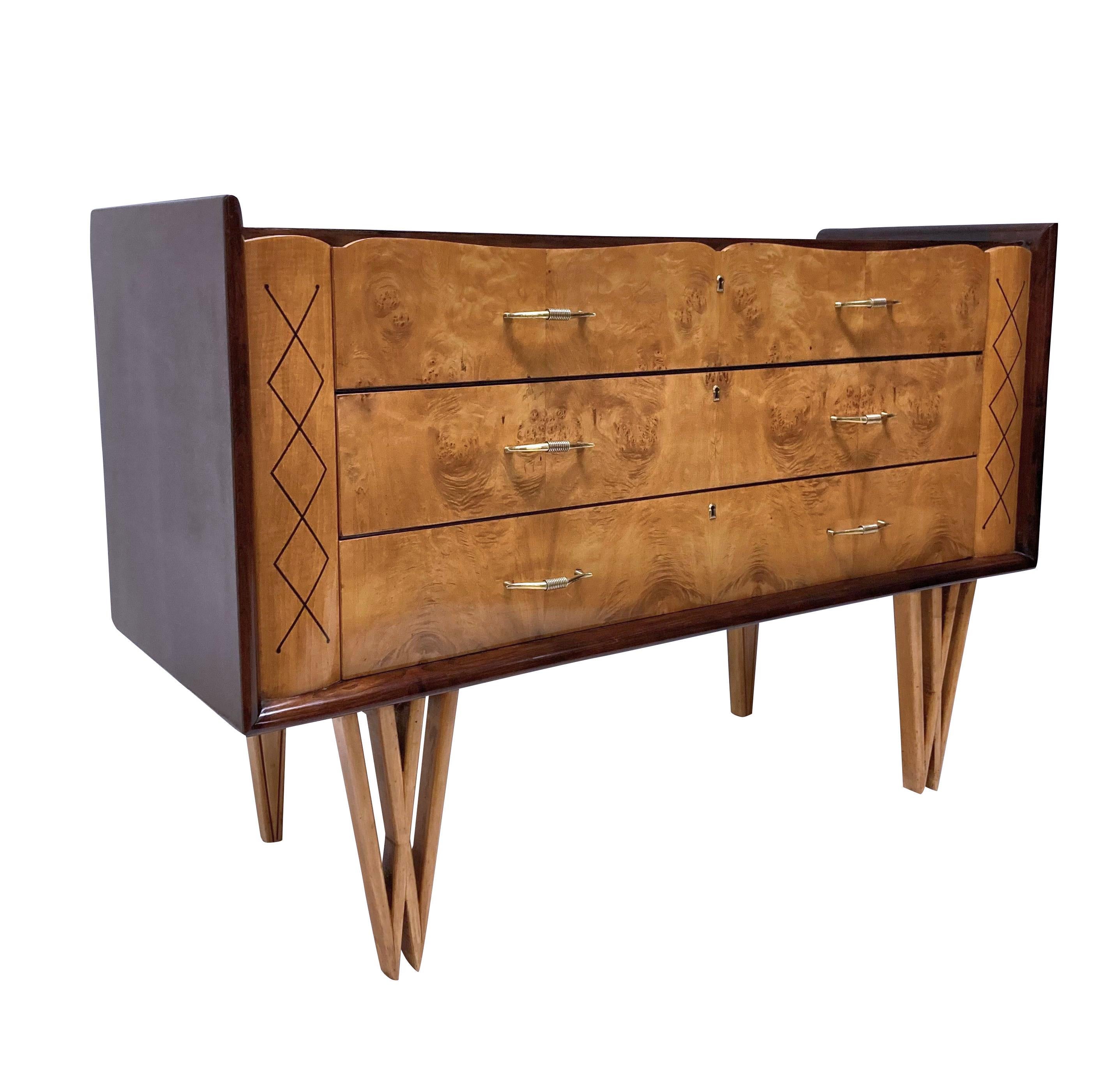 A stylish French Mid-Century credenza of unusual design. With three drawers in walnut, each with elegant brass handles. Supported on double 'v' shaped front legs in fruitwood and the drawers each flanked by a hand painted design.