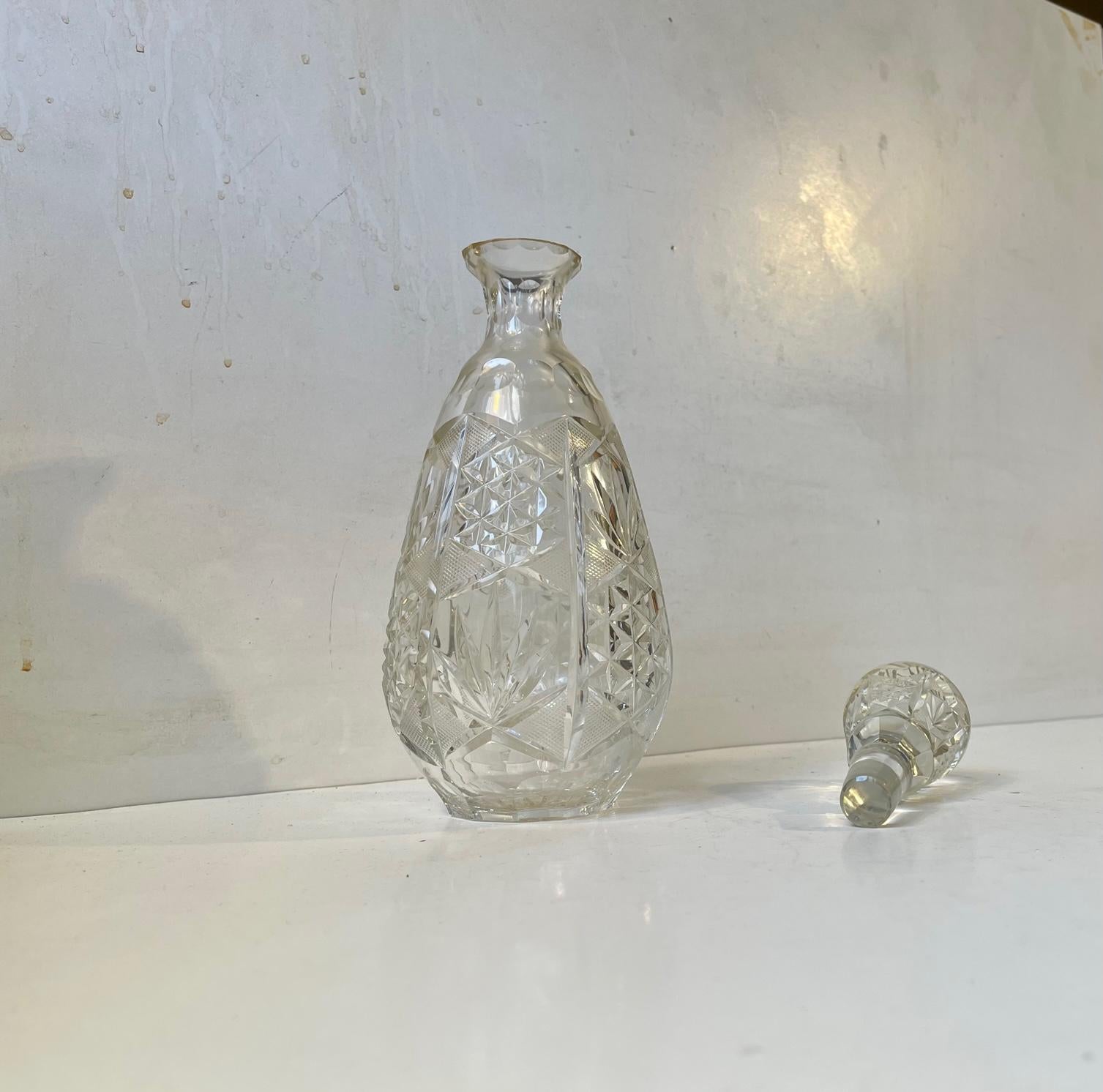 Cristal de Lorraine has an inheritance that goes back all the way to 1764. They have created crystal ware for names like Hermés, Cartier and St. Dupont. This 24% lead crystal decanter dates to the 1950s or early 1960s. Its many cut edges and