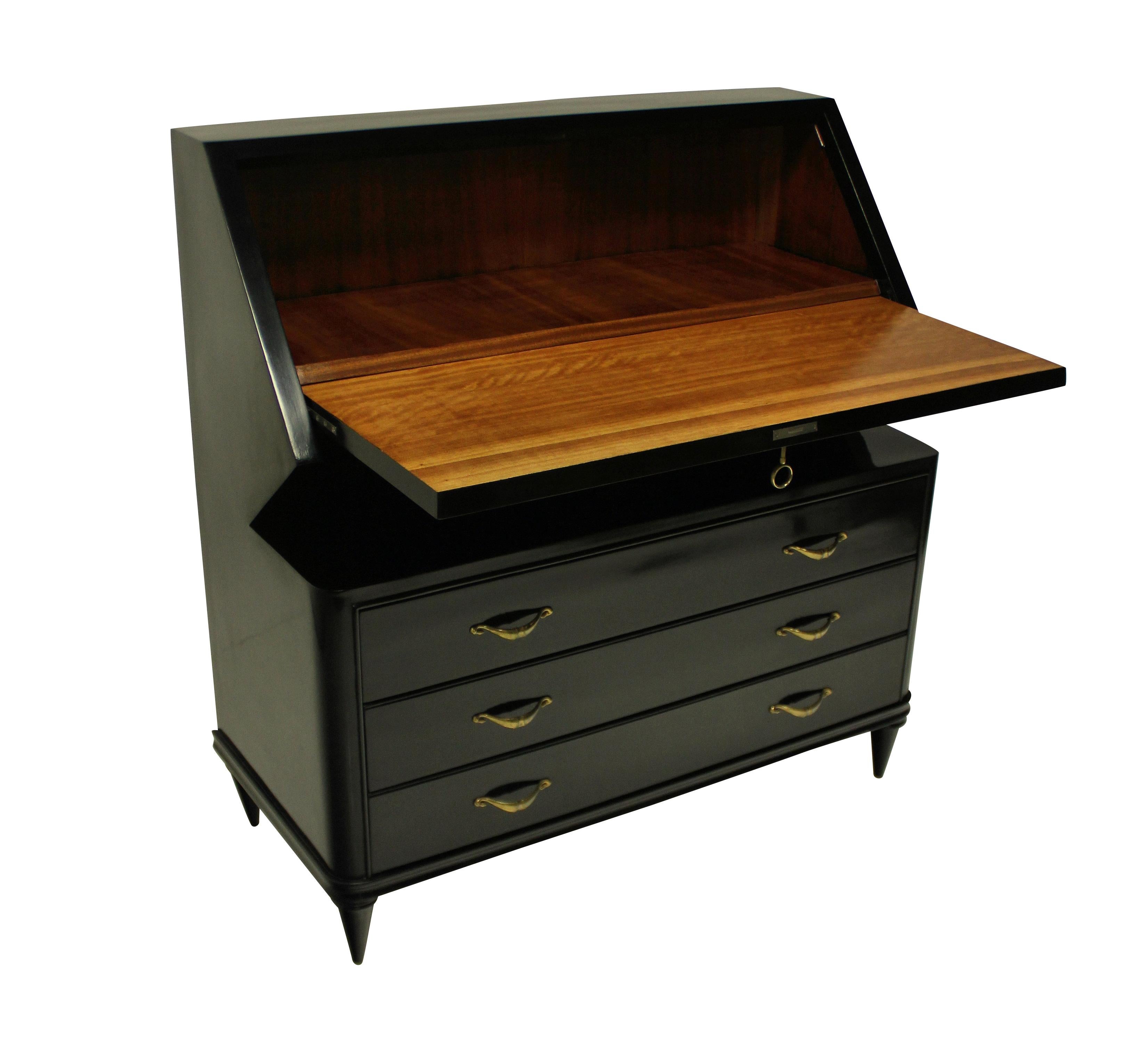 An elegant French midcentury ebonised bureau, with three drawers and a fall front desk. With swag shaped brass handles, a decorative key and star motif to the door.
