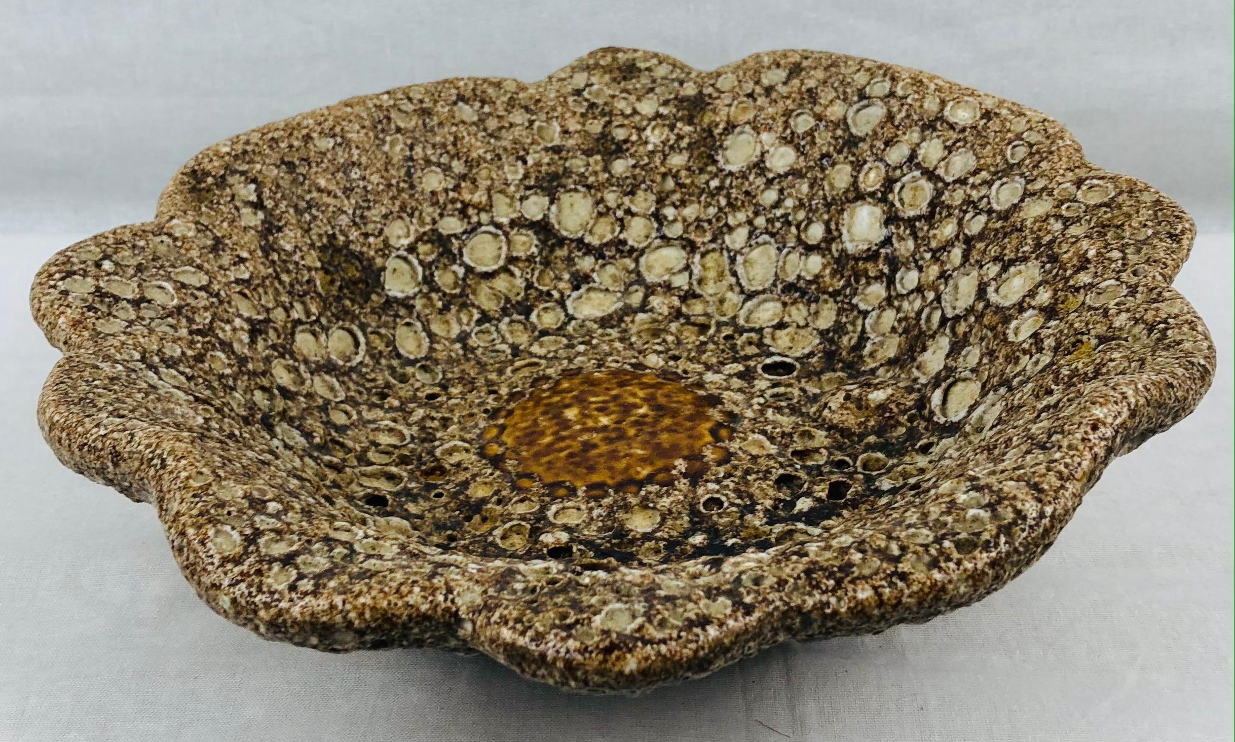 A wonderful decorative bowl from Vallauris made in the manner of Charles Cart's fat lava ceramics. 

The firing process reveals the multiple layers below the multicolored glaze in a way which suggests lava or glaciers. Will enhance the look of any