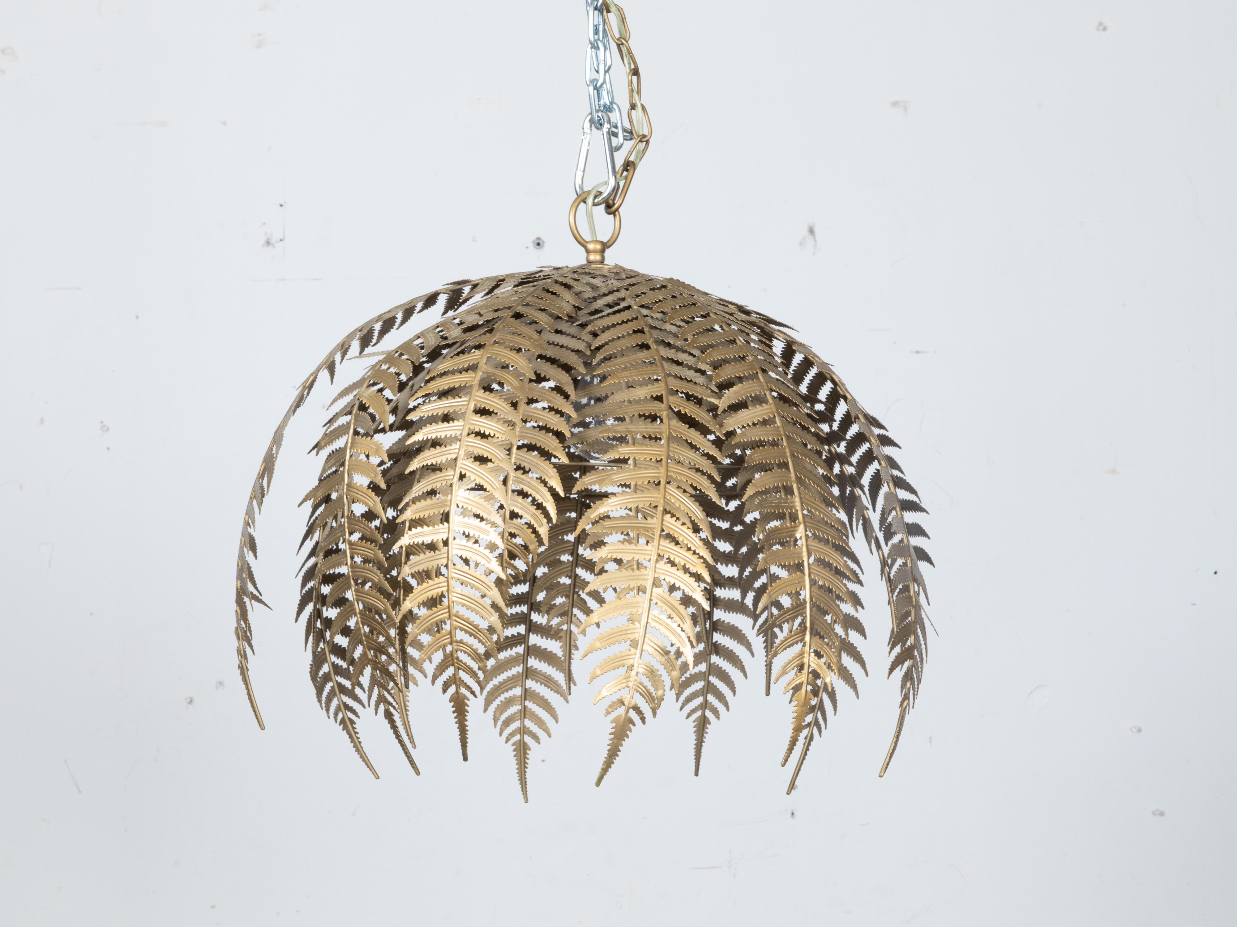 A French Midcentury gilt metal fern-themed chandelier with single light. Imbue your living space with an organic touch with this French Midcentury gilt metal fern-themed chandelier. Showcasing undeniable craftsmanship, this single-light chandelier