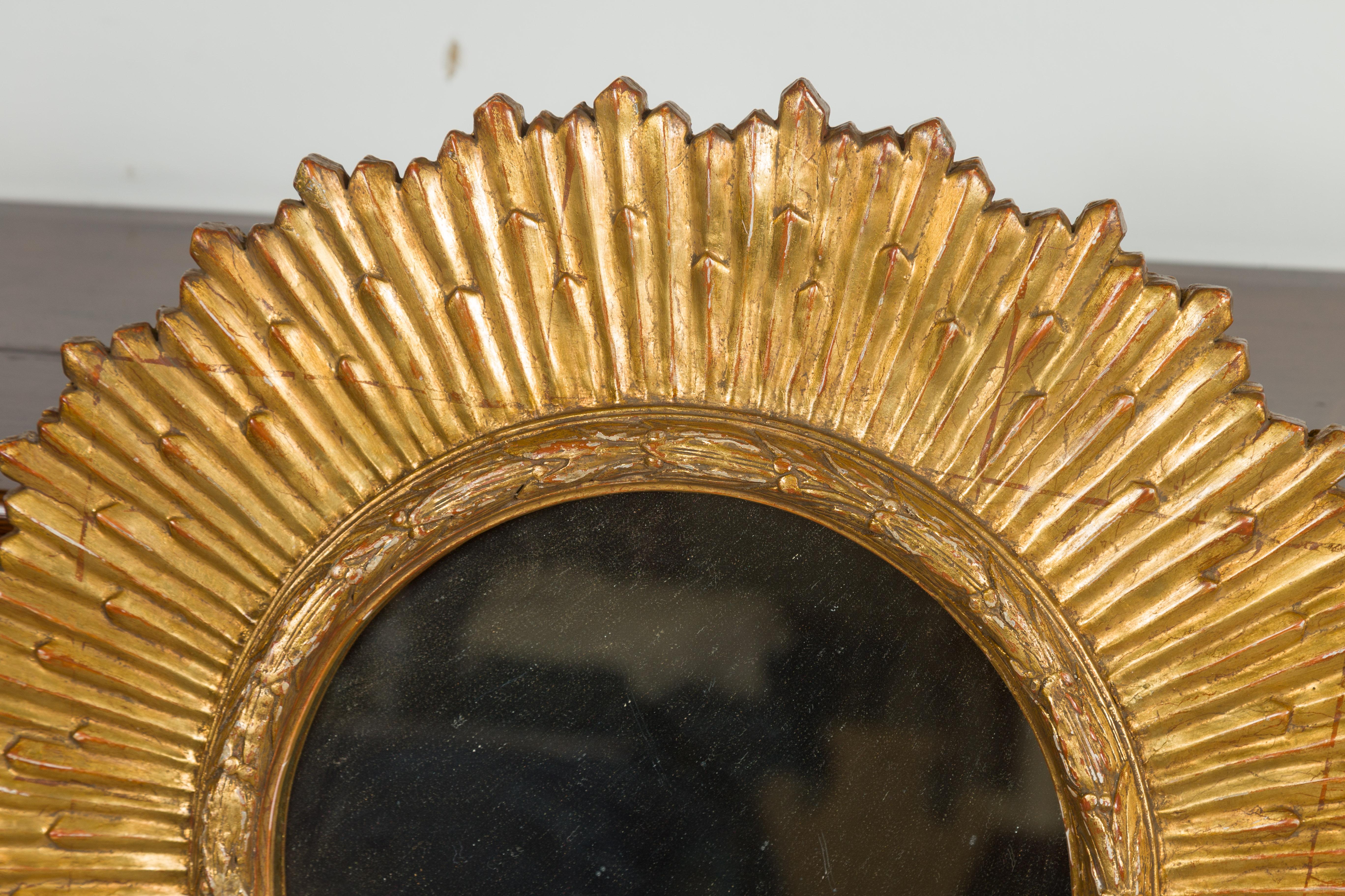20th Century French Midcentury Giltwood Sunburst Mirror with Radiating Rays and Carved Frame For Sale