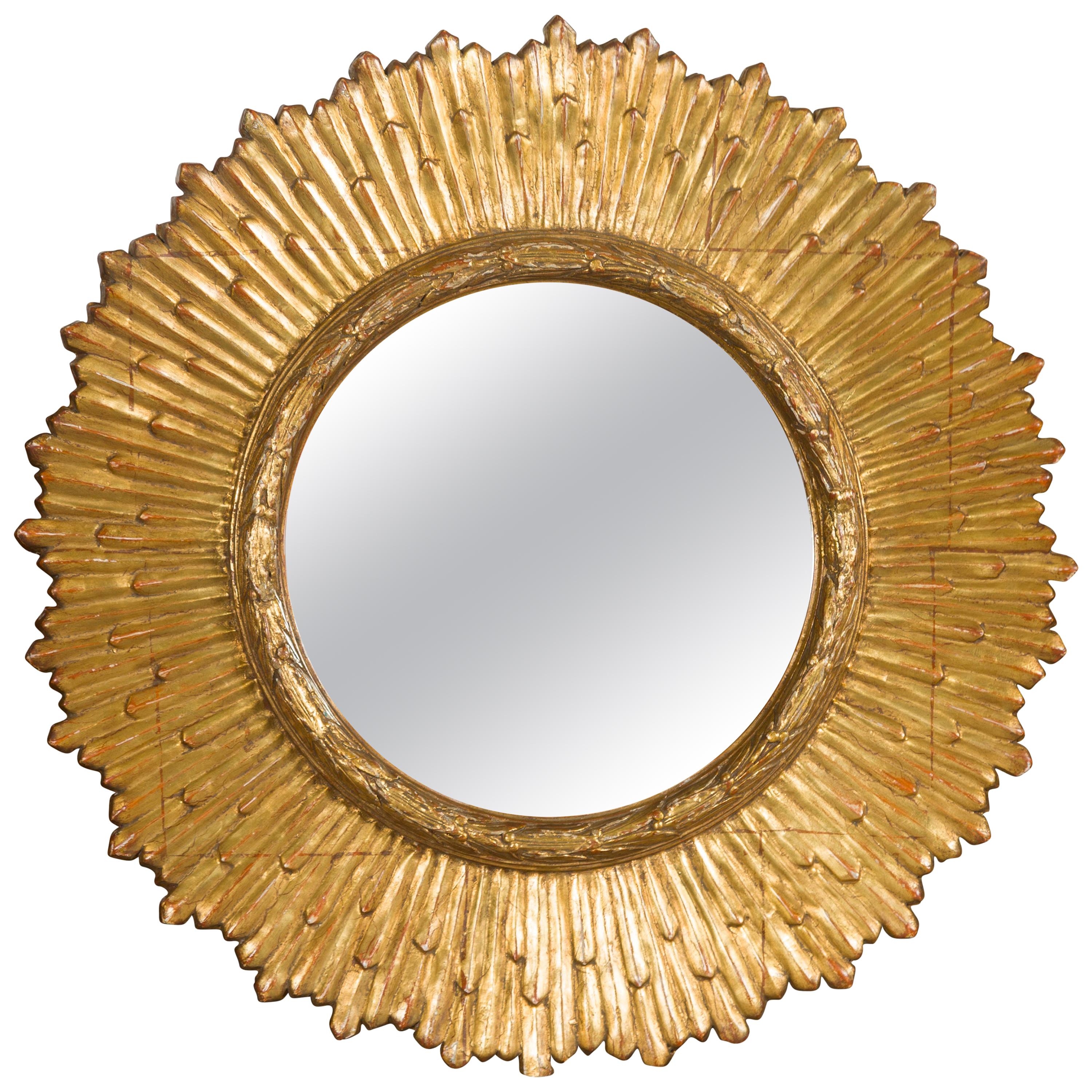 French Midcentury Giltwood Sunburst Mirror with Radiating Rays and Carved Frame For Sale