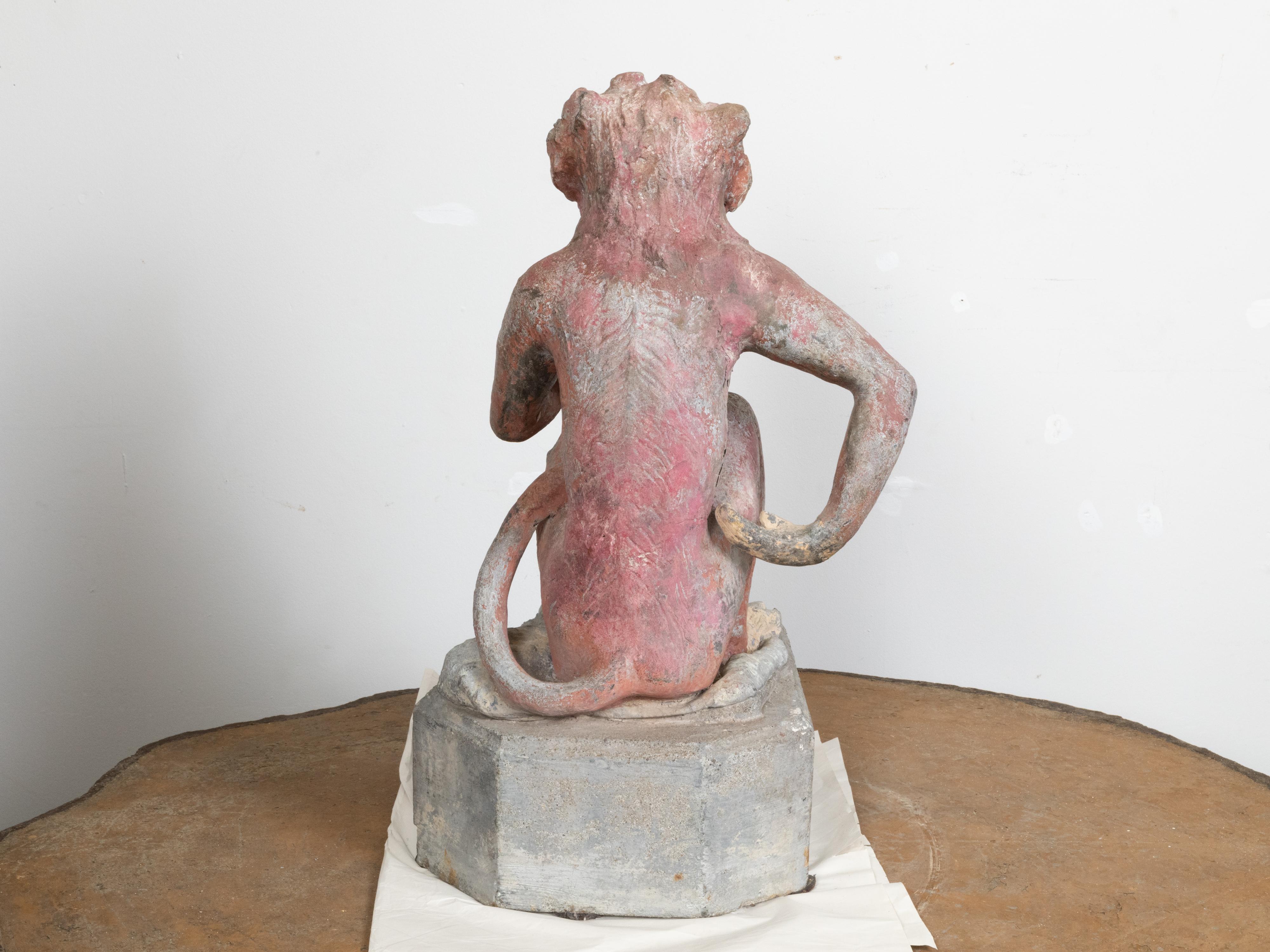 French Midcentury Lead Sculpture of a Monkey Eating a Banana with Aged Patina In Good Condition For Sale In Atlanta, GA