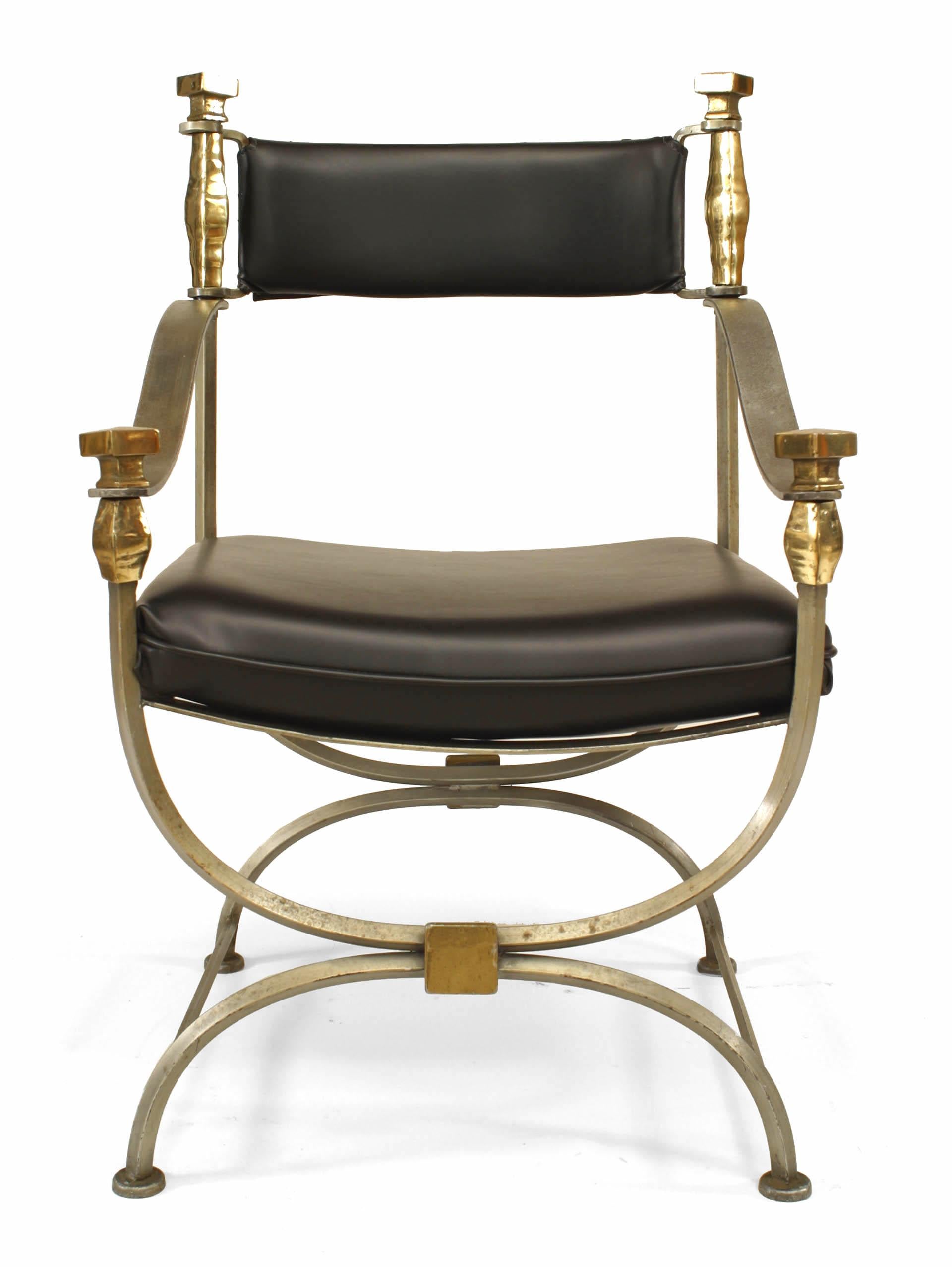 French Mid-Century Modern Campaign chair inspired by neoclassical design and featuring steel and brass trimmed construction as well as a crossed leg design and leather-upholstered seat and back.

 