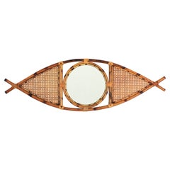 Miroir français du milieu du siècle dernier en forme d'œil, rotin et osier, années 1960