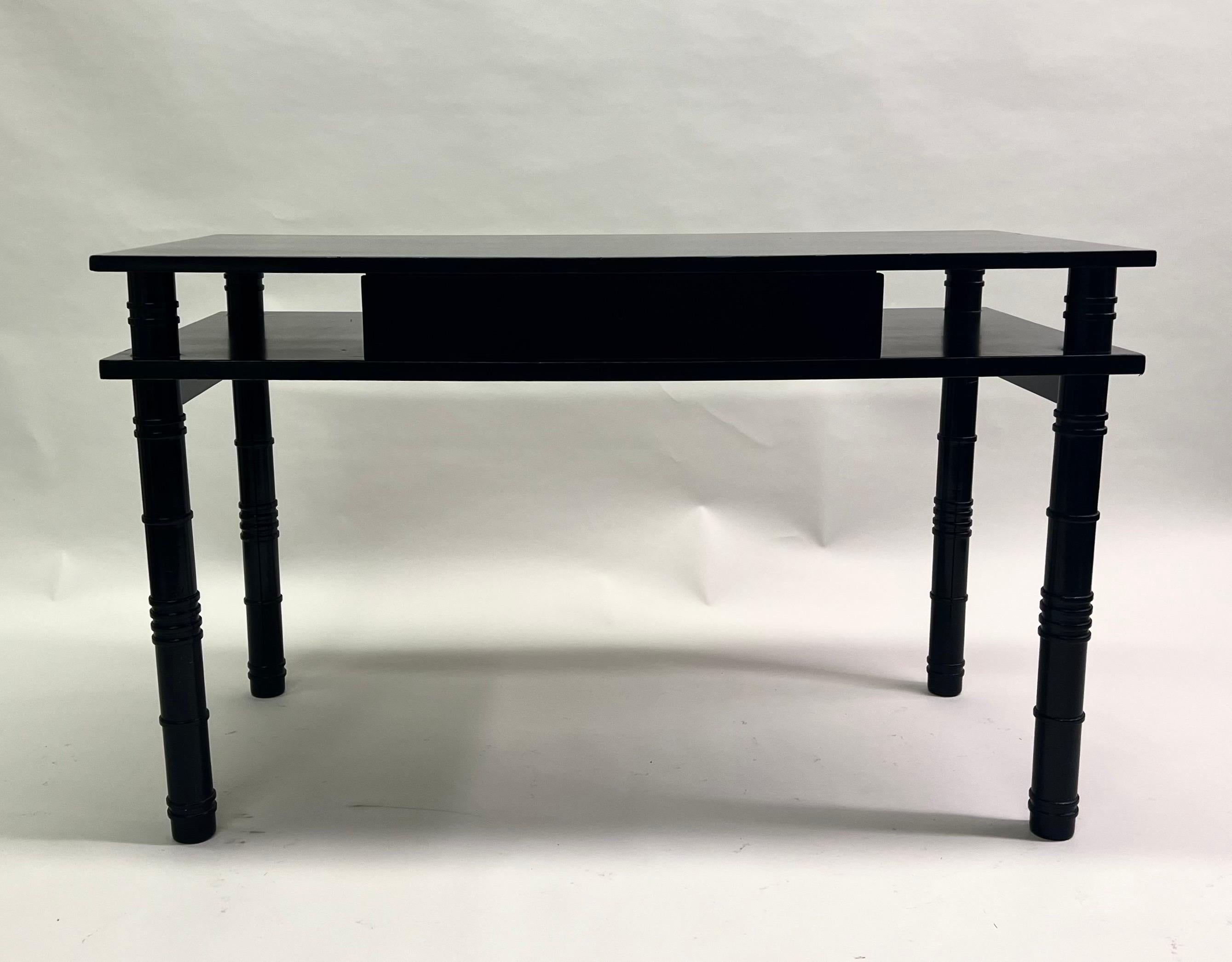 Important Late French Art Deco / Mid-Century Modern Neoclassical double level writing table / desk in Ebonized solid Sycamore by Leon Jallot, 1936. This rare, early modern piece was constructed to allow transparency, open-ness and light to play an