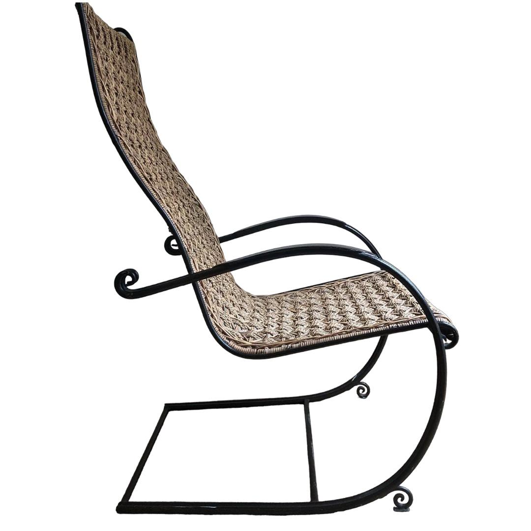 Fabulous vintage midcentury rattan and wrought iron armchair from France. Woven wicker seat and back with a lightweight yet sturdy frame with mod, streamlined curves, very comfortable. Overall in excellent condition.