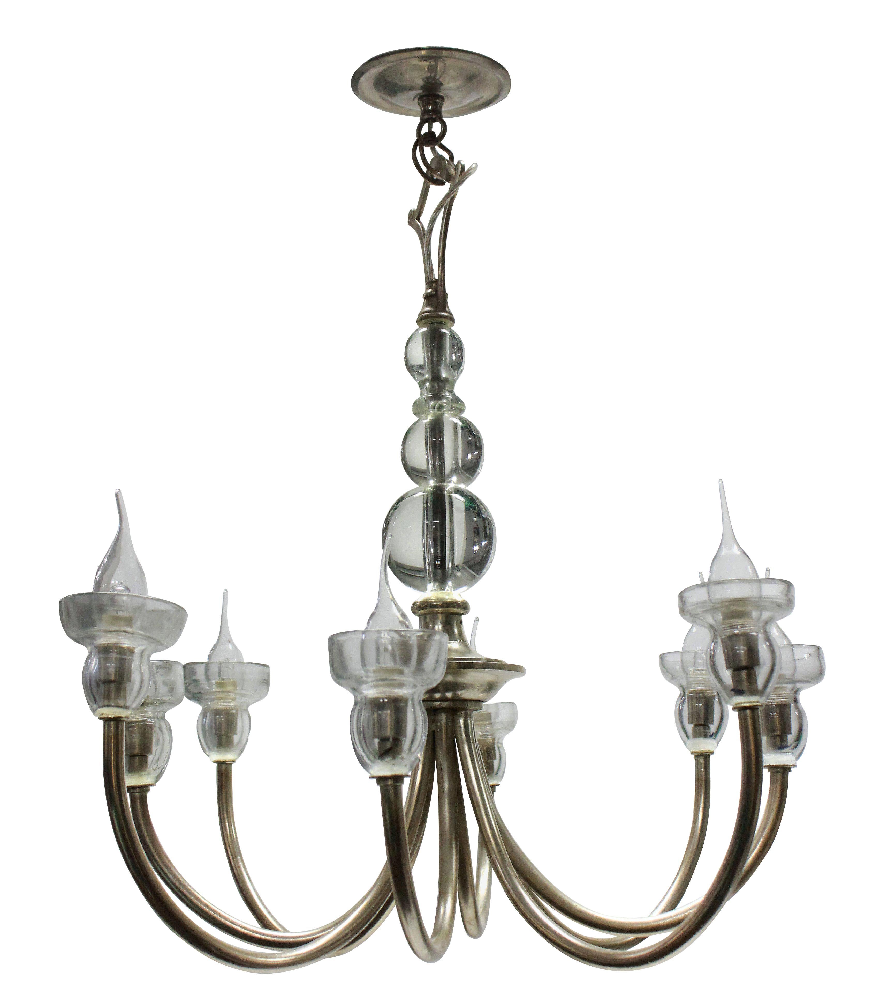 A French chandelier of interesting design in silvered metal with good quality glass detailing with a spherical centre stem and drip sconces.