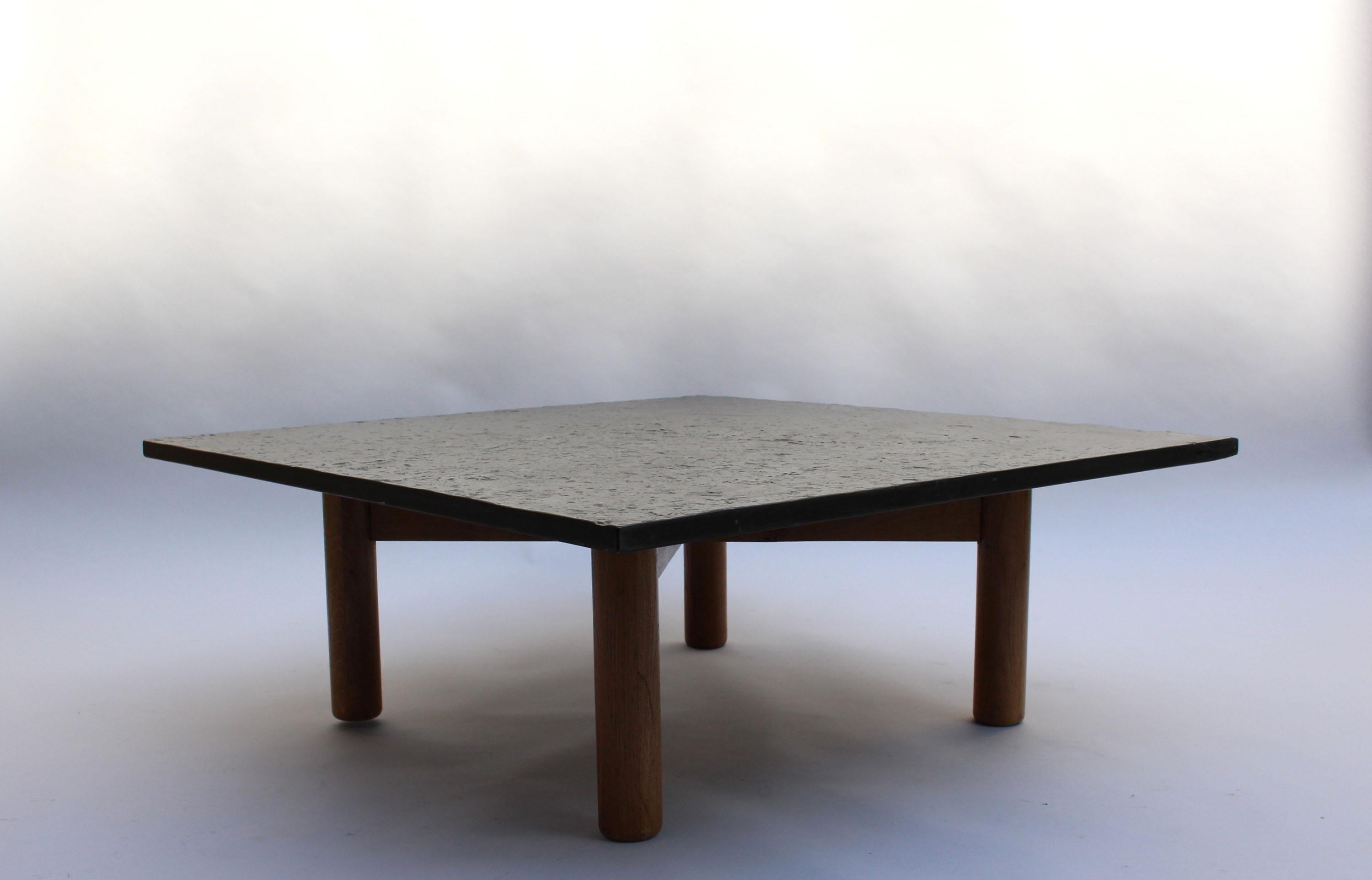 Fine large French Mid-Century coffee table, with a slate top sitting on a solid oak four legs base.