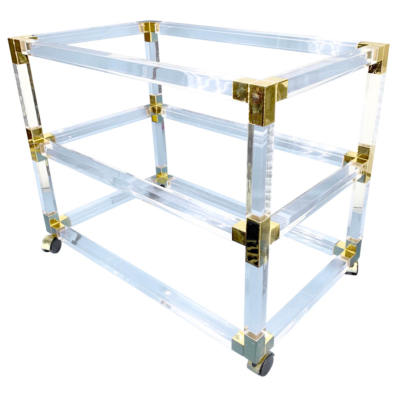 French Mid-Century three-tier bar cart trolley in lucite, brass and glass shelves.