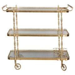 French Midcentury Three-Tiered Brass Cart with Glass Shelves and Spindle Motifs