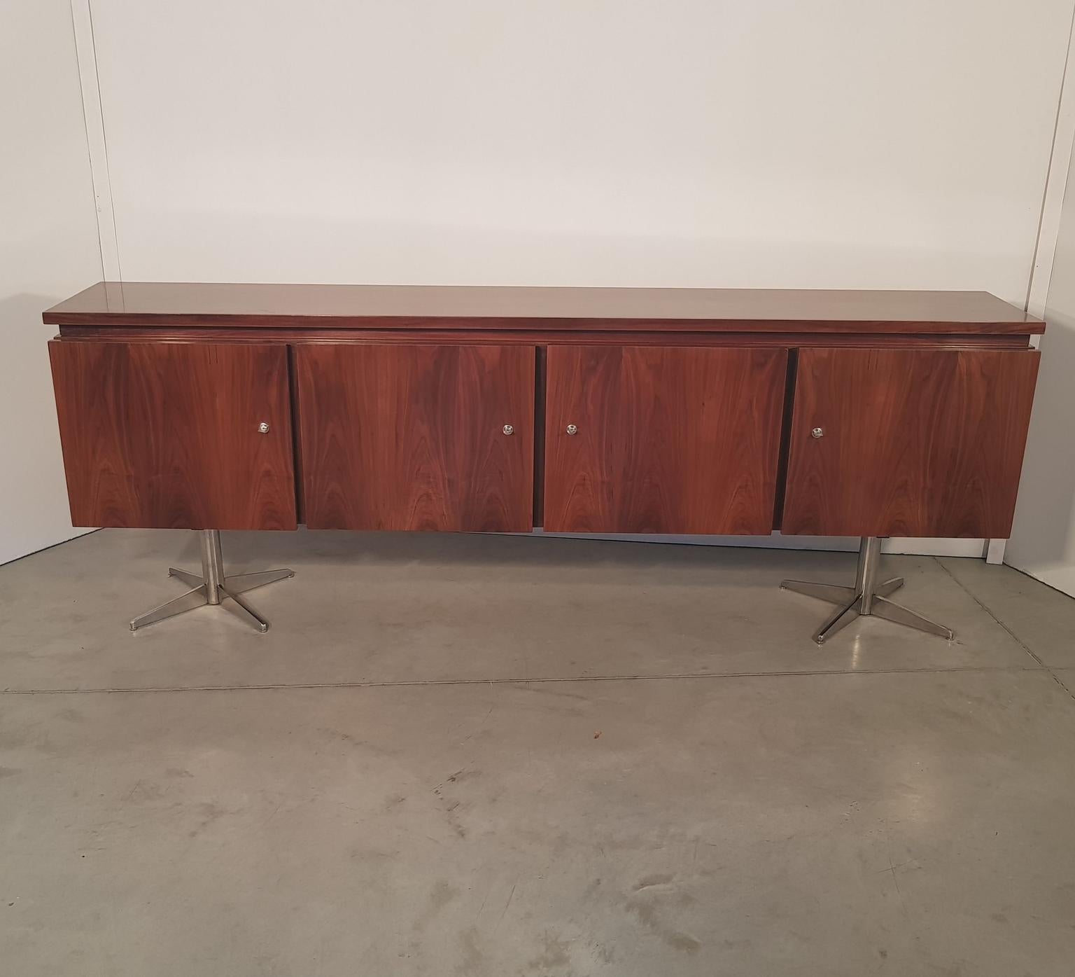 Silky polished walnut sideboard on incredible chrome legs. Inside mahogany veneer, shelves and five drawers. France, 1970s.