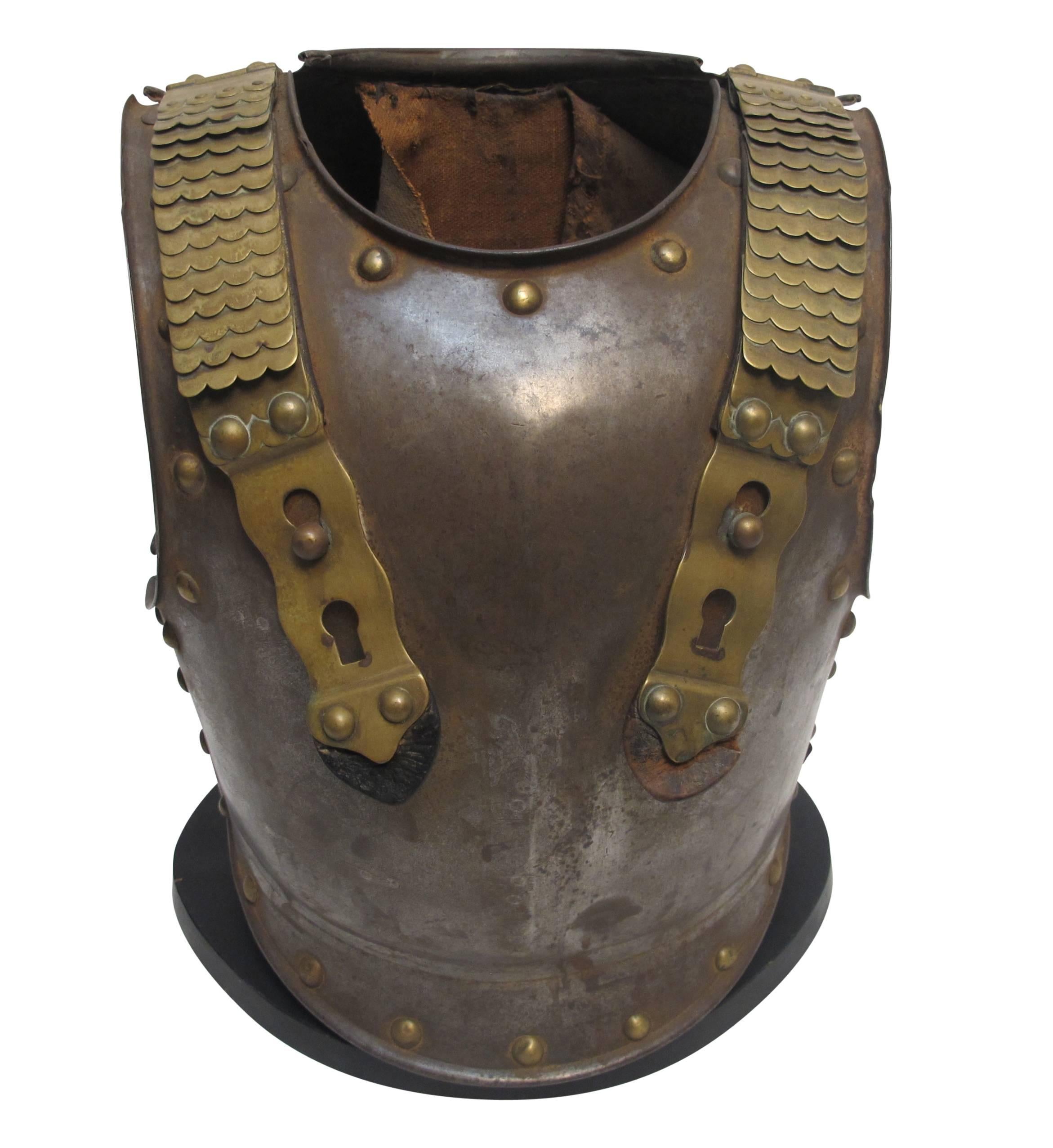 French military steel and brass breast plate body armor, having a genuine muscat ball dent, France, late 18th-early 19th century.