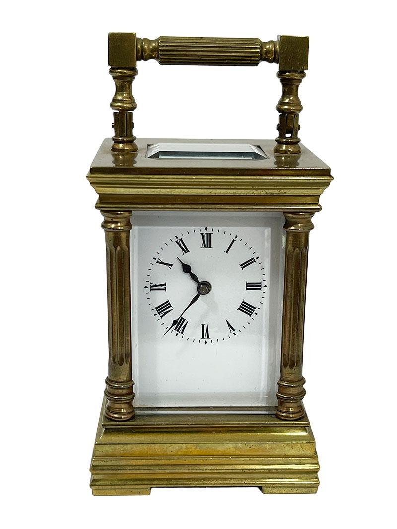 French miniature brass carriage clock in case

The carriage clock in black leather case has an enamel dial with Roman numerals. The mechanism with an anchor escapement and is of a later date
The measurement of the clock is 7.5 cm high and with