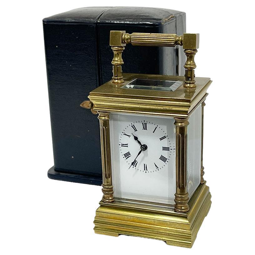 French miniature brass carriage clock in case
