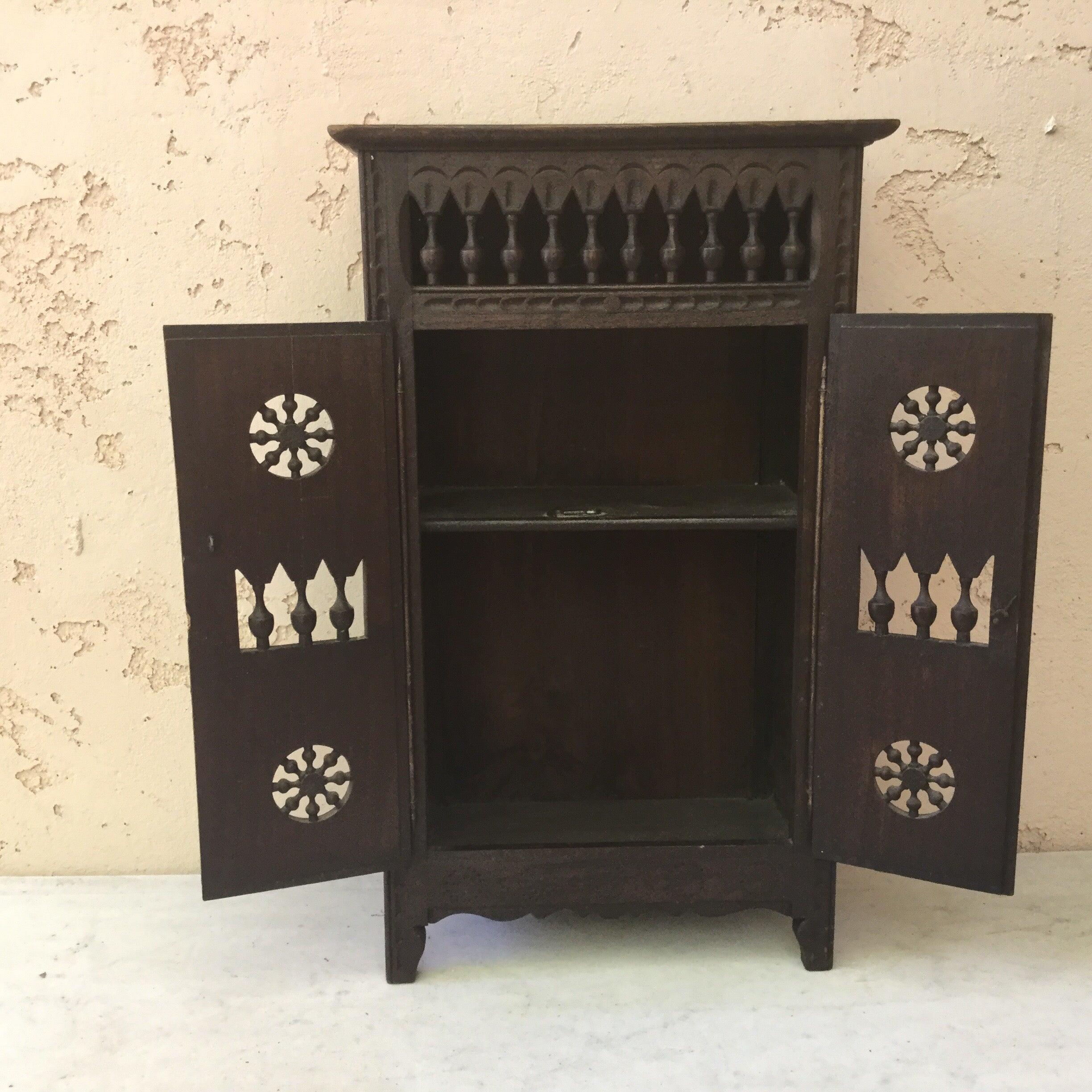French miniature armoire from Brittany with two doors in carved wood (Wheels and columns).