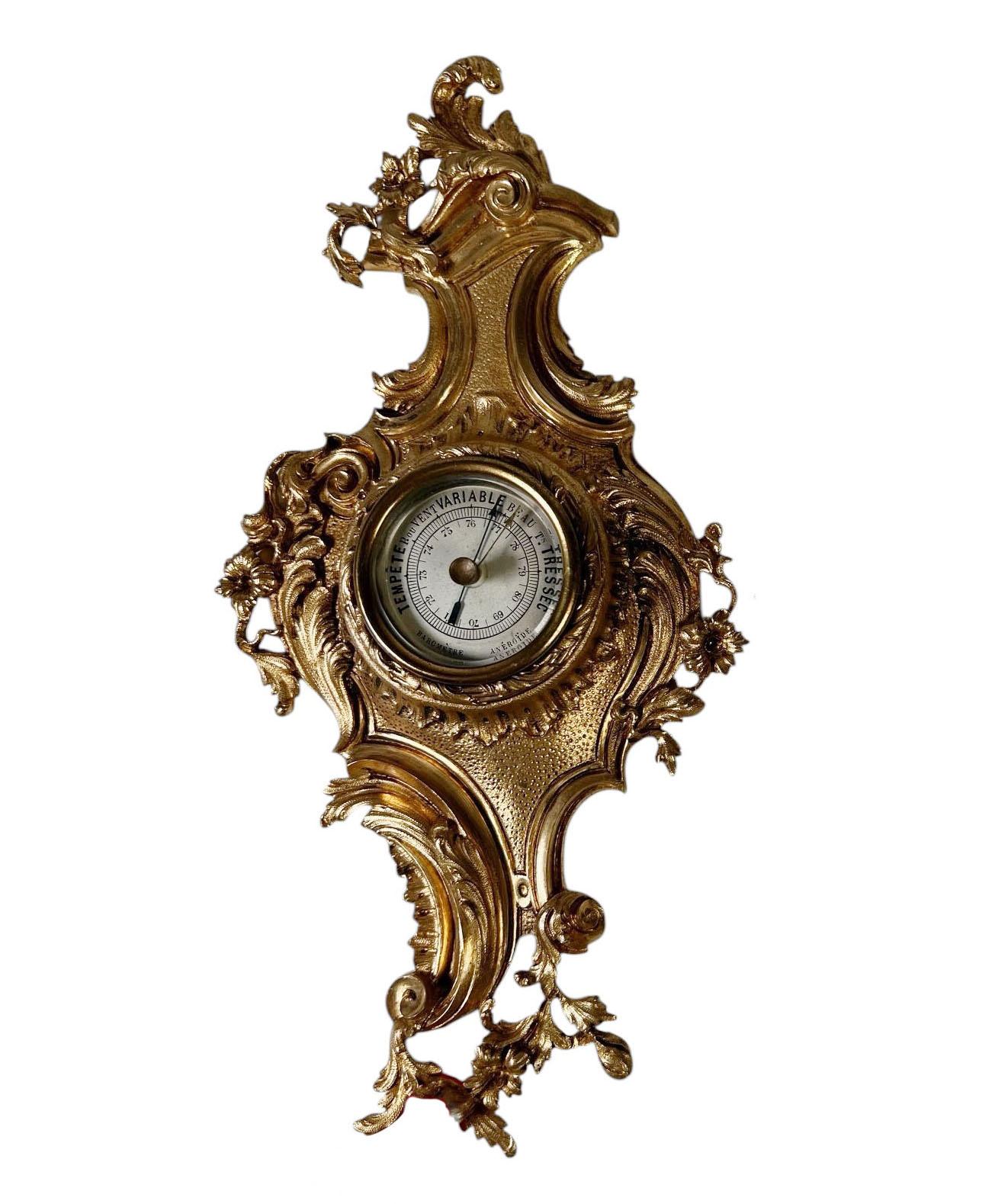 A finely crafted pair of miniature scientific instruments, featuring a centigrade thermometer and barometer housed in ornate bronze doré casings. French, circa 1890, these pieces reflect the precision and elegance of late 19th century design, with