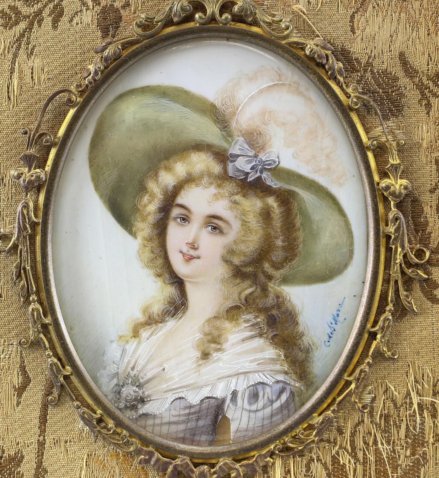 French Miniature Lady's Portrait Gilt Bronze Frame Hand Painted, 19th Century

Signed. 19th Century. Baroque style young gentlewoman in a large green hat.

Additional Information:
Region of Origin: Europe 
Size Type/Largest Dimension: Small