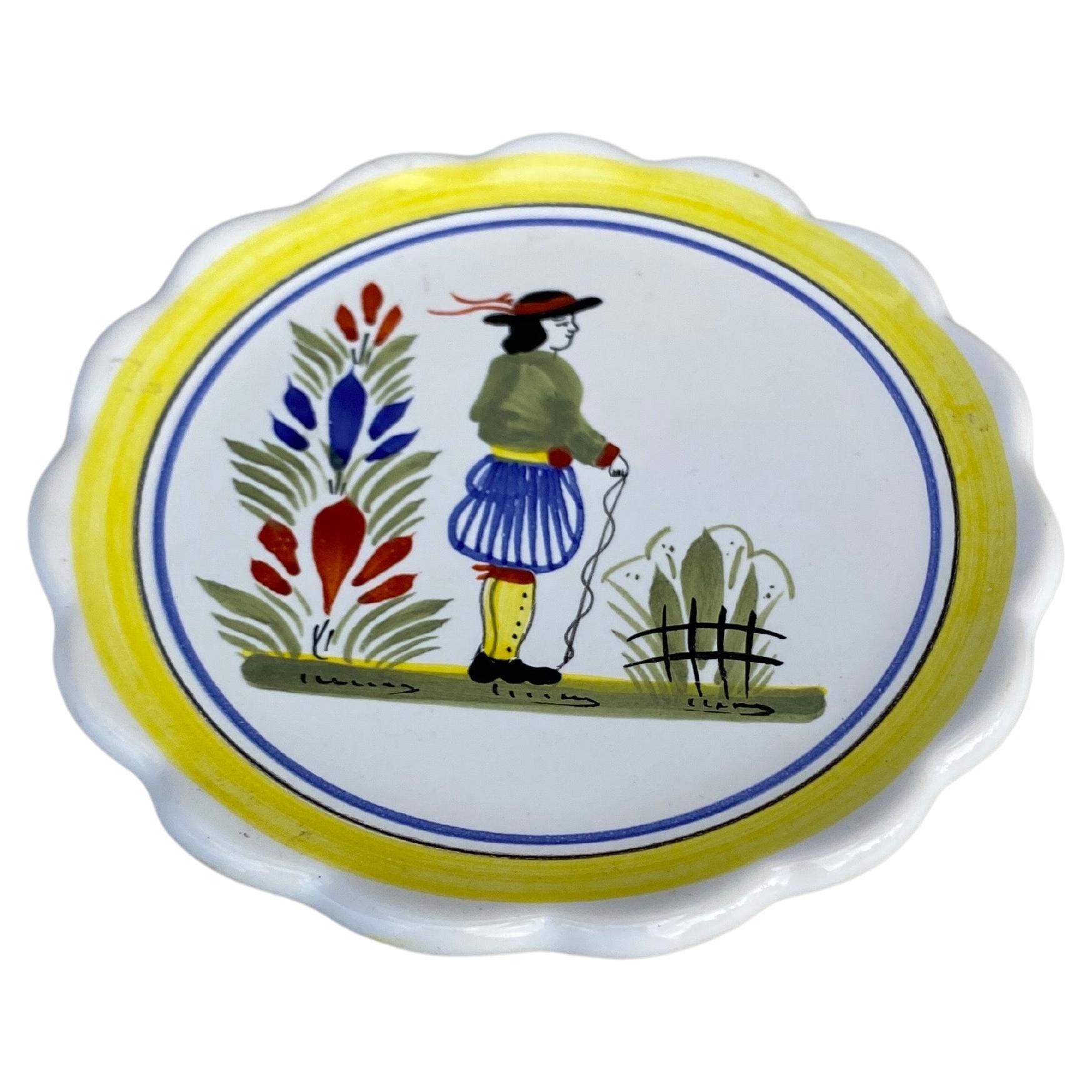 French Miniature Henriot Quimper Plate signed circa 1950.
A breton man is represented on the center with a yellow border.