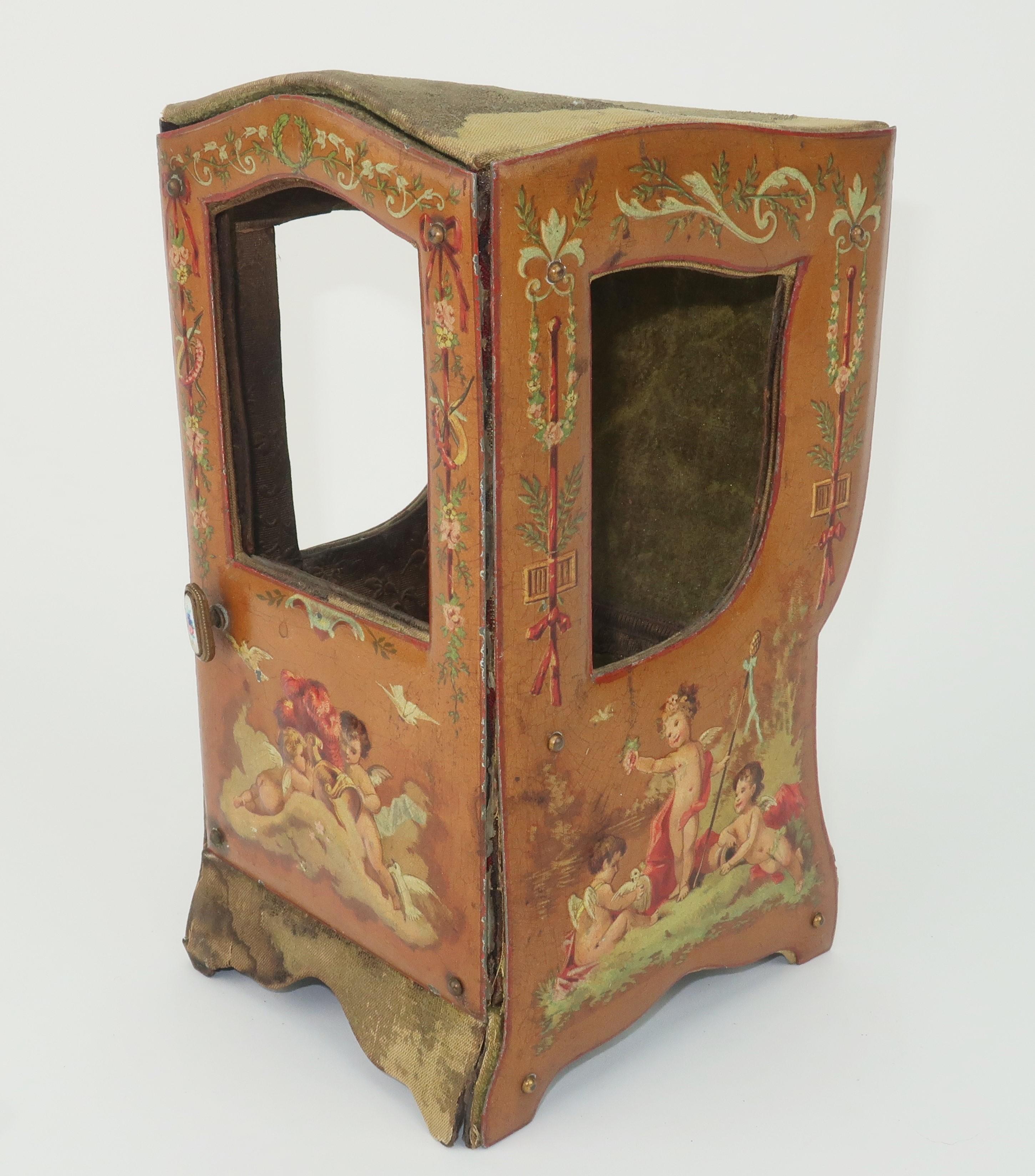 Pocket watch perfection!  A charming late 19th Century French pocket watch display stand in the form of a miniature sedan chair.  The sedan is made with cardboard style construction covered in silk and velvet with pressed and lithographed tin sides