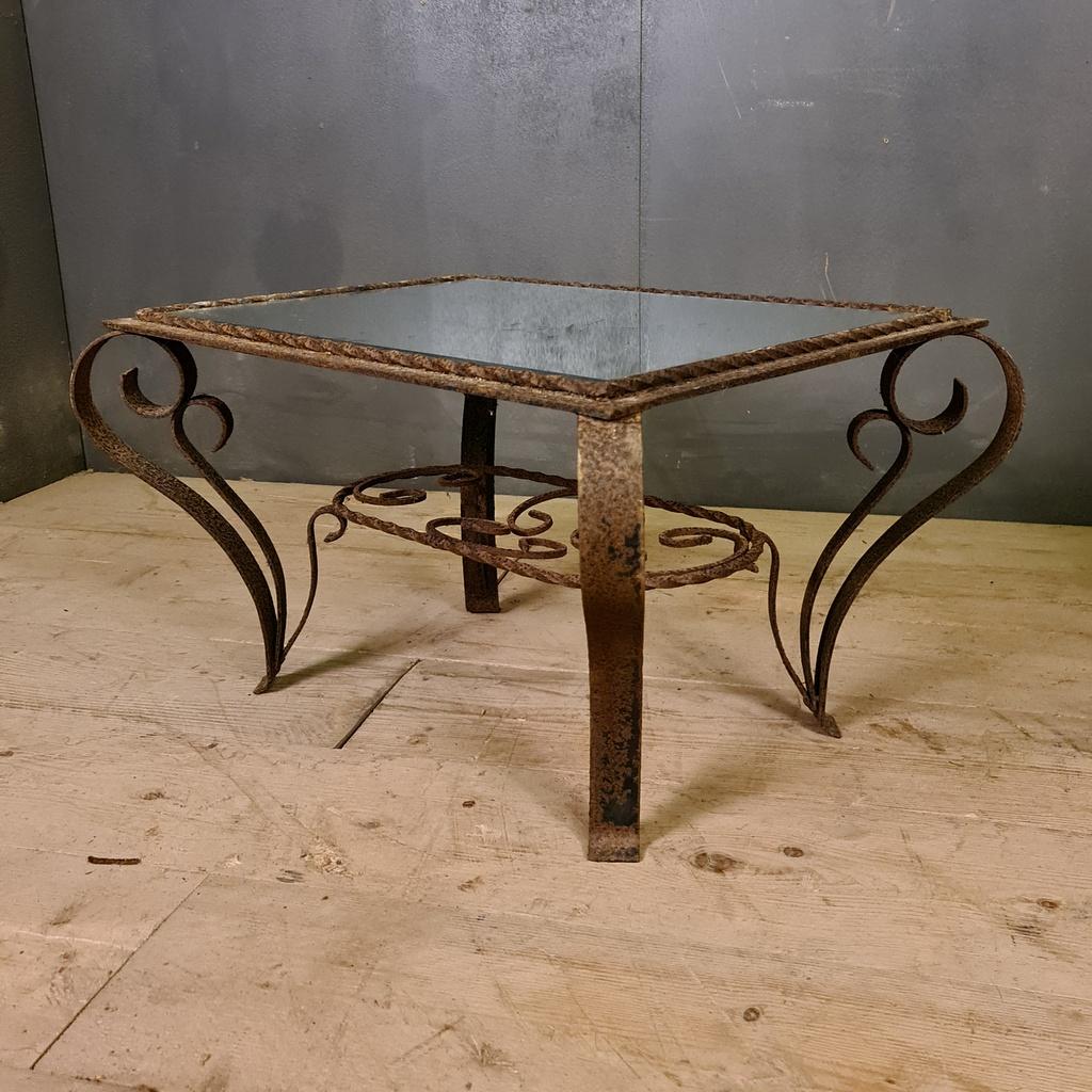 1920s French iron and mirrored low table, 1920.

Dimensions
28.5 inches (72 cms) wide
22 inches (56 cms) deep
16 inches (41 cms) high.