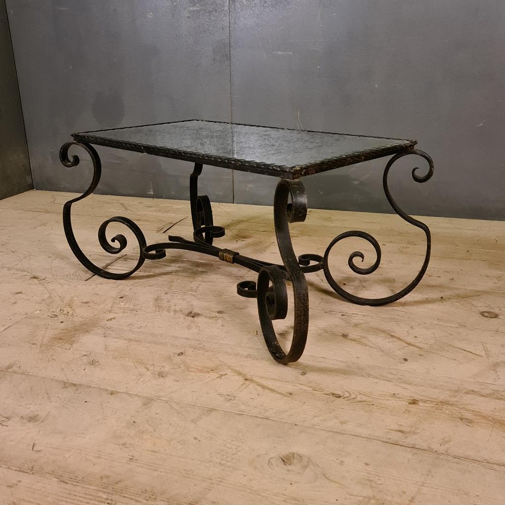 1920s French iron and mirrored low table, 1920.

Dimensions
33.5 inches (85 cms) wide
18.5 inches (47 cms) deep
16 inches (41 cms) high.