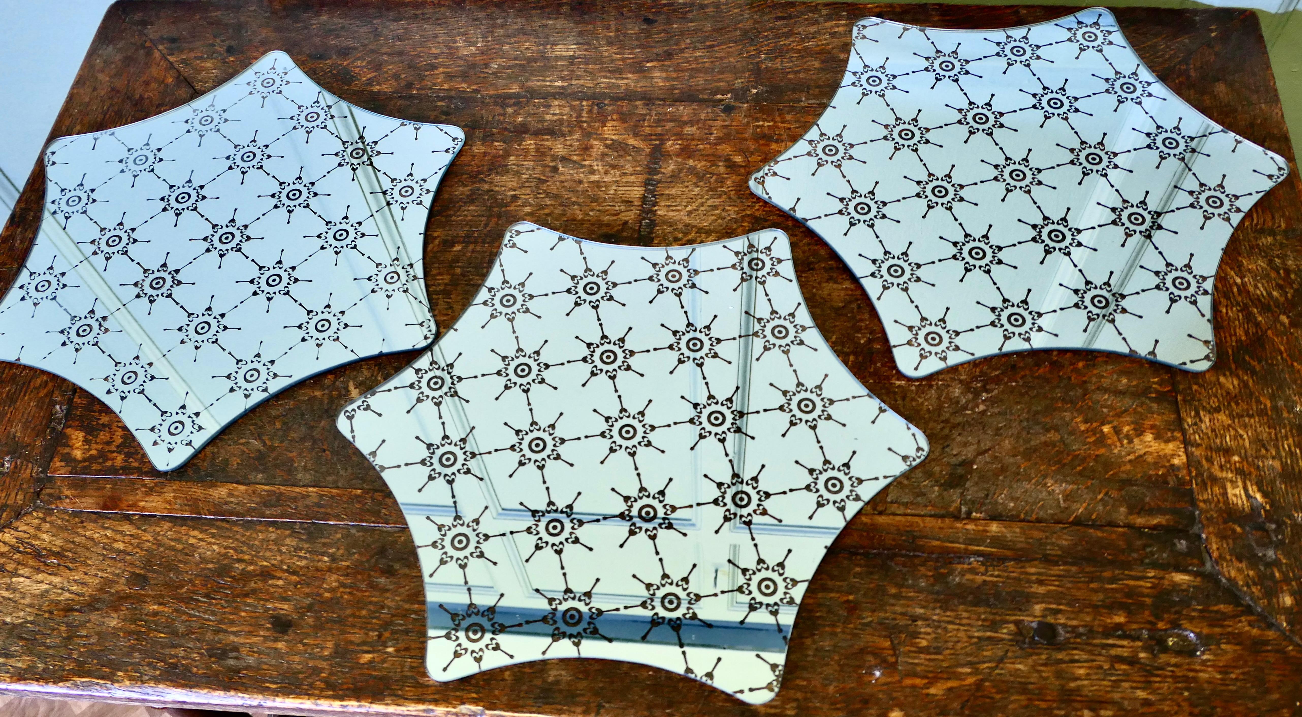 French Mirrored Sideboard Mats

A lovely trio which sits on your serving table or sideboard to add charm and protection to the top surface.
The mats are a 6 star shape with star decoration and they have small feet underneath.
In good condition with