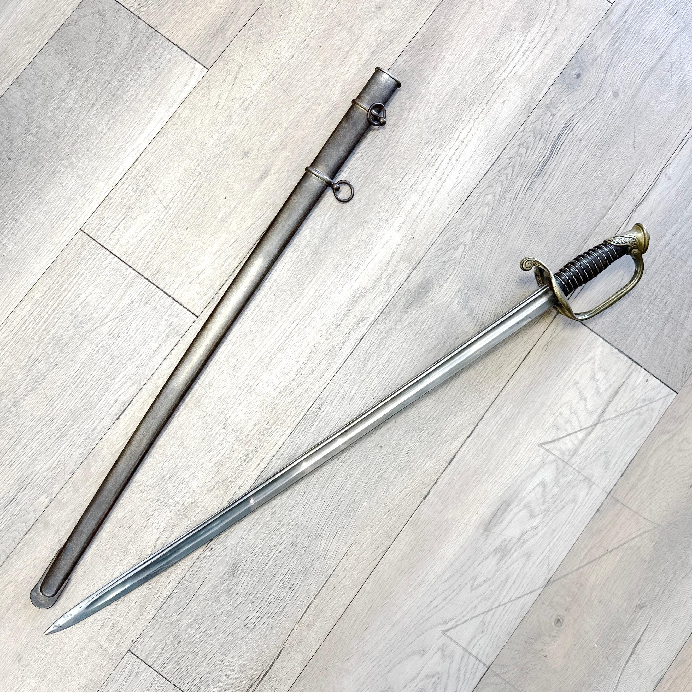 This is an original French Model 1855 Army Officer’s Sword, complete with its full-length steel scabbard. Used during the mid-to-late 19th century, this regulation sidearm was standard issue for officers of the French military and features the
