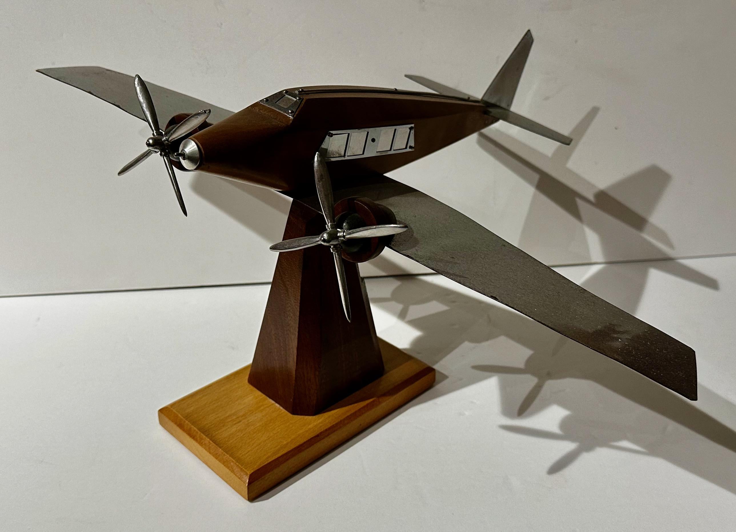 French Model Propeller Airplane Wood Metal Art Deco. Mixed wood with lots of metalwork. Wings, propeller, tail, and windows. Fashioned after The Dewoitine which was an Art Deco 1930s French eight-passenger airliner built by Dewoitine. The Airplane