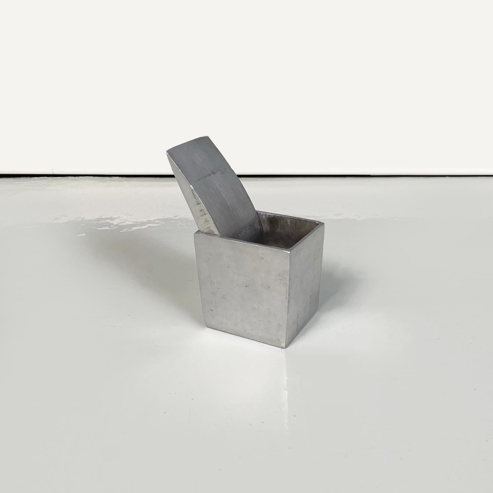 French modern aluminum table ashtray Ray Hollis by Philippe Starck, 1990s
Fantastic and iconic table ashtray mod. Ray Hollis with rectangular aluminum base. The structure tends to shrink towards the bottom. Features a lid on top.
It was produced
